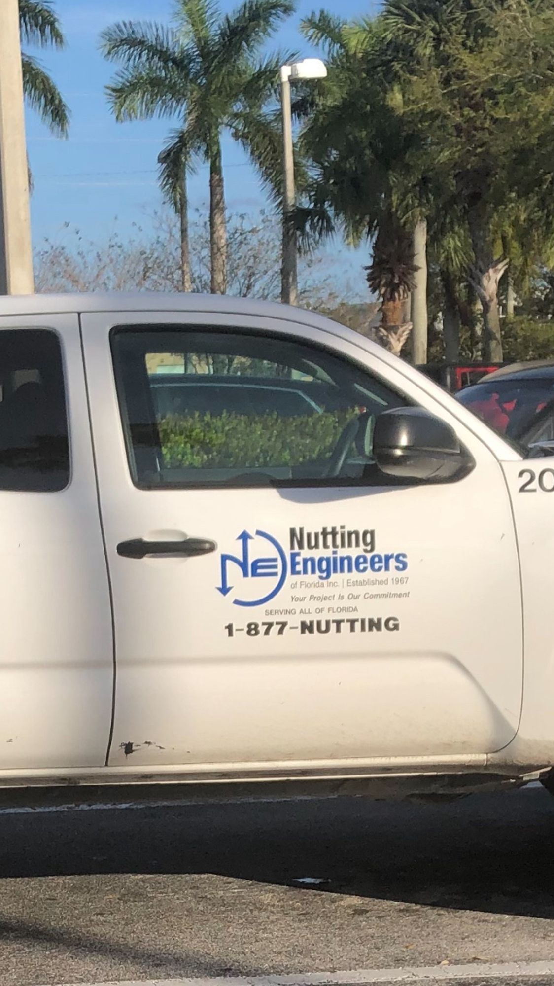 An engineers work truck which reads, “Nutting Engineers”