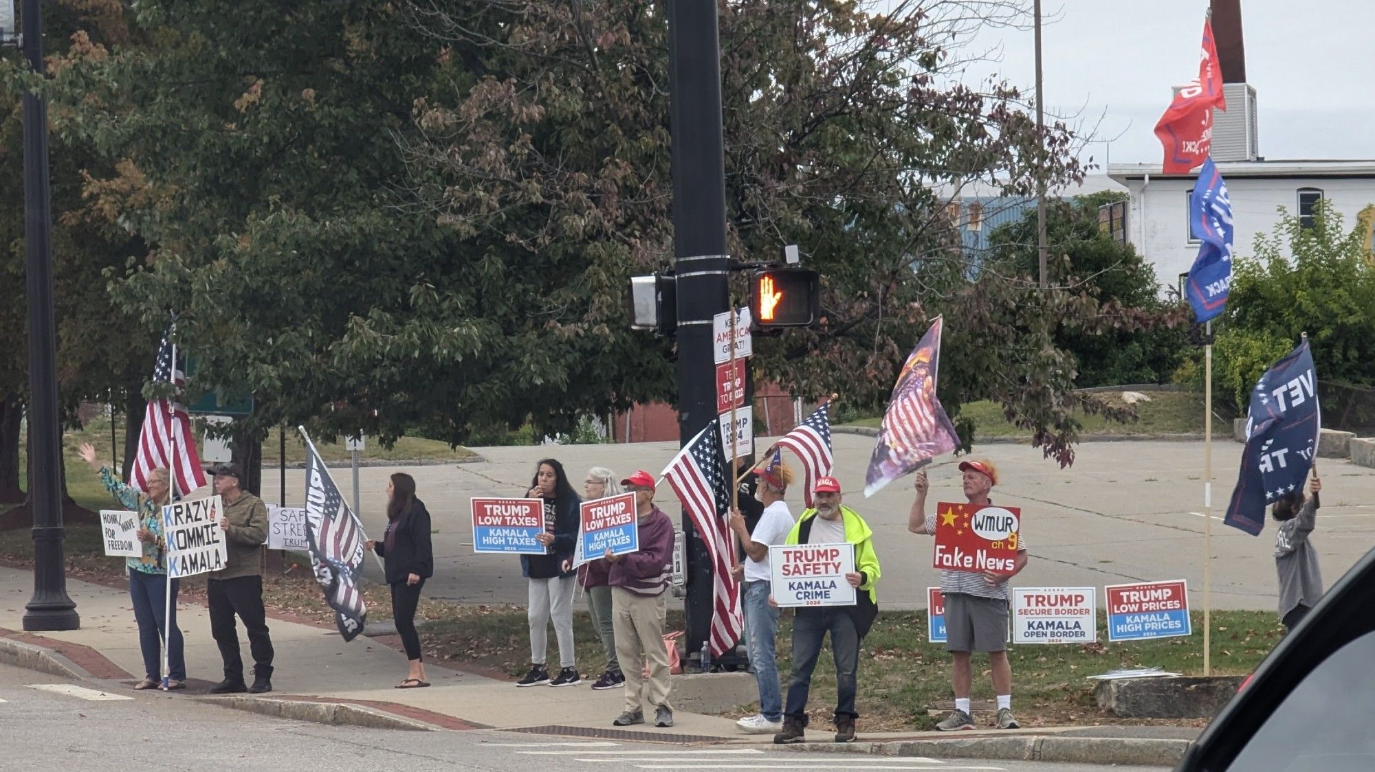 group of Trumpers in Manchester "showing the flag" for Trump (and other loony things like Krazy Kommie Kamala, WMUR Fake News, etc)