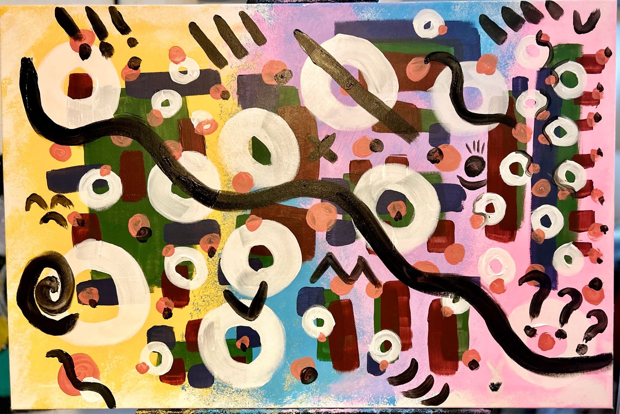 Abstract artwork with yellow, blue and pink background with various coloured shapes and white circles with black lines and symbols