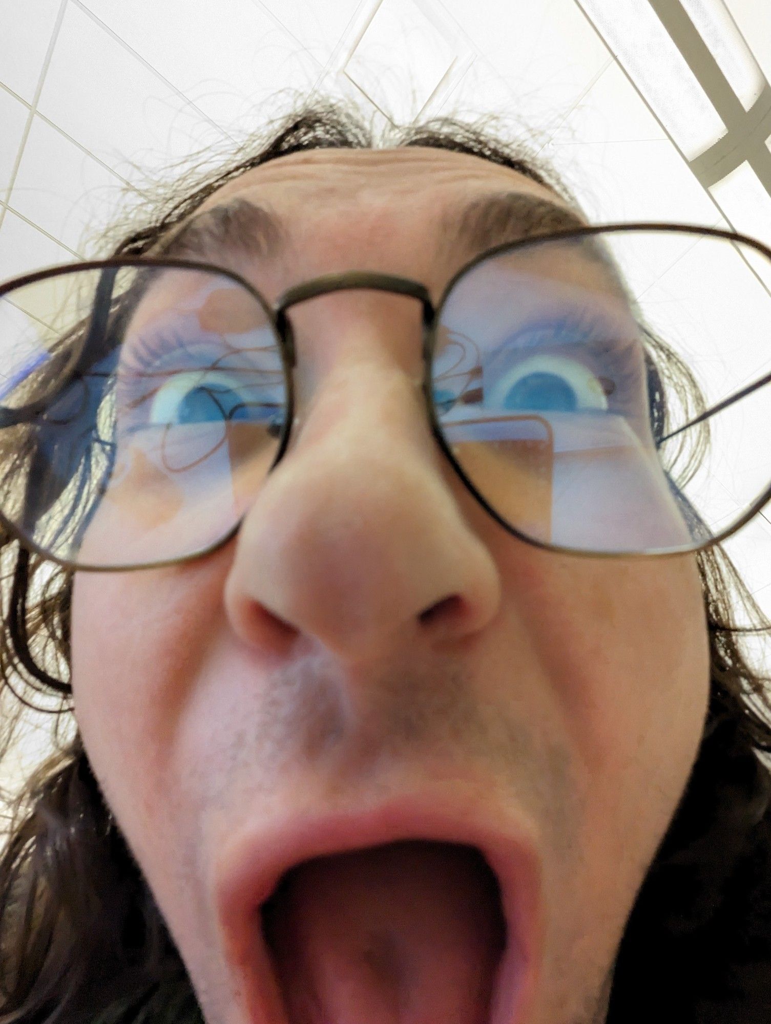 Me making a poggers face really close to the camera using a wide angle lens