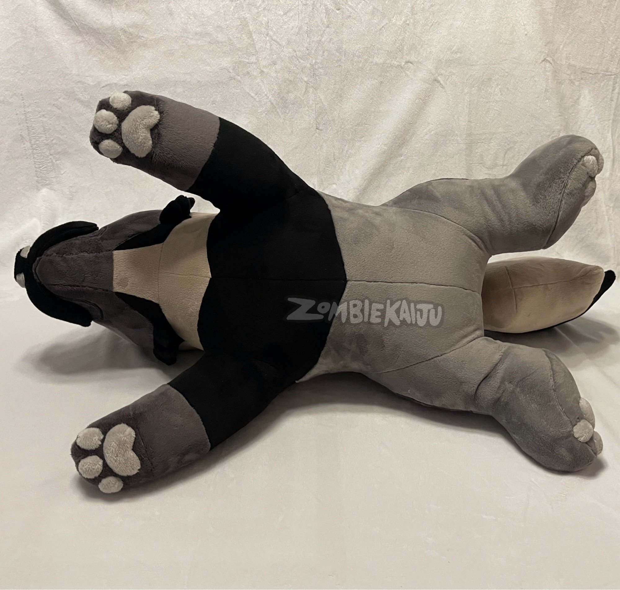 same plush photographed with his belly showing