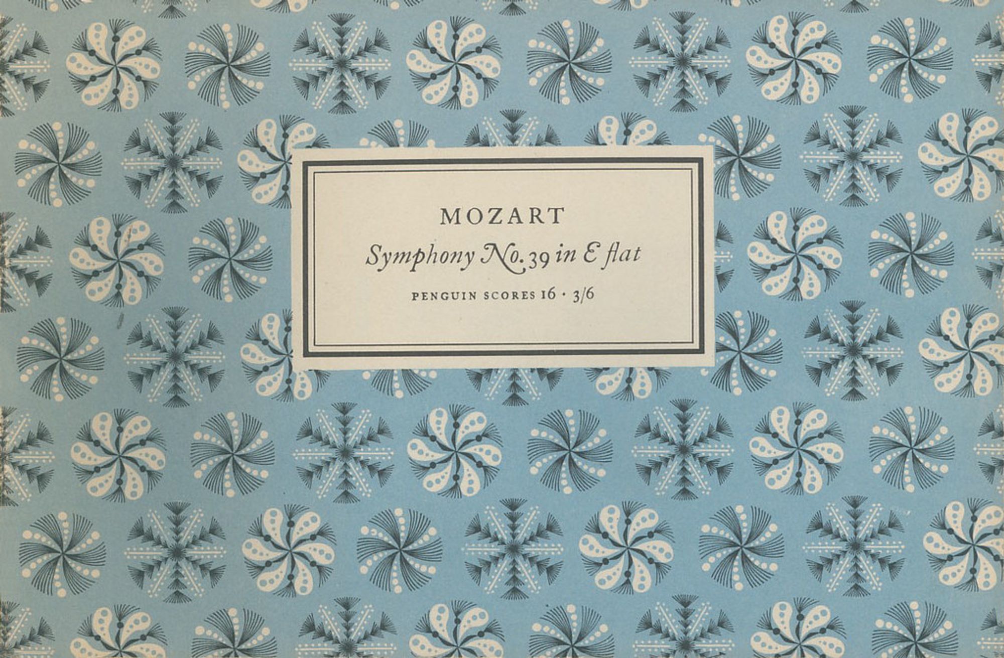 Cover of Mozart score with repeated pattern of intricate geometric snowflakes on light-blue ground