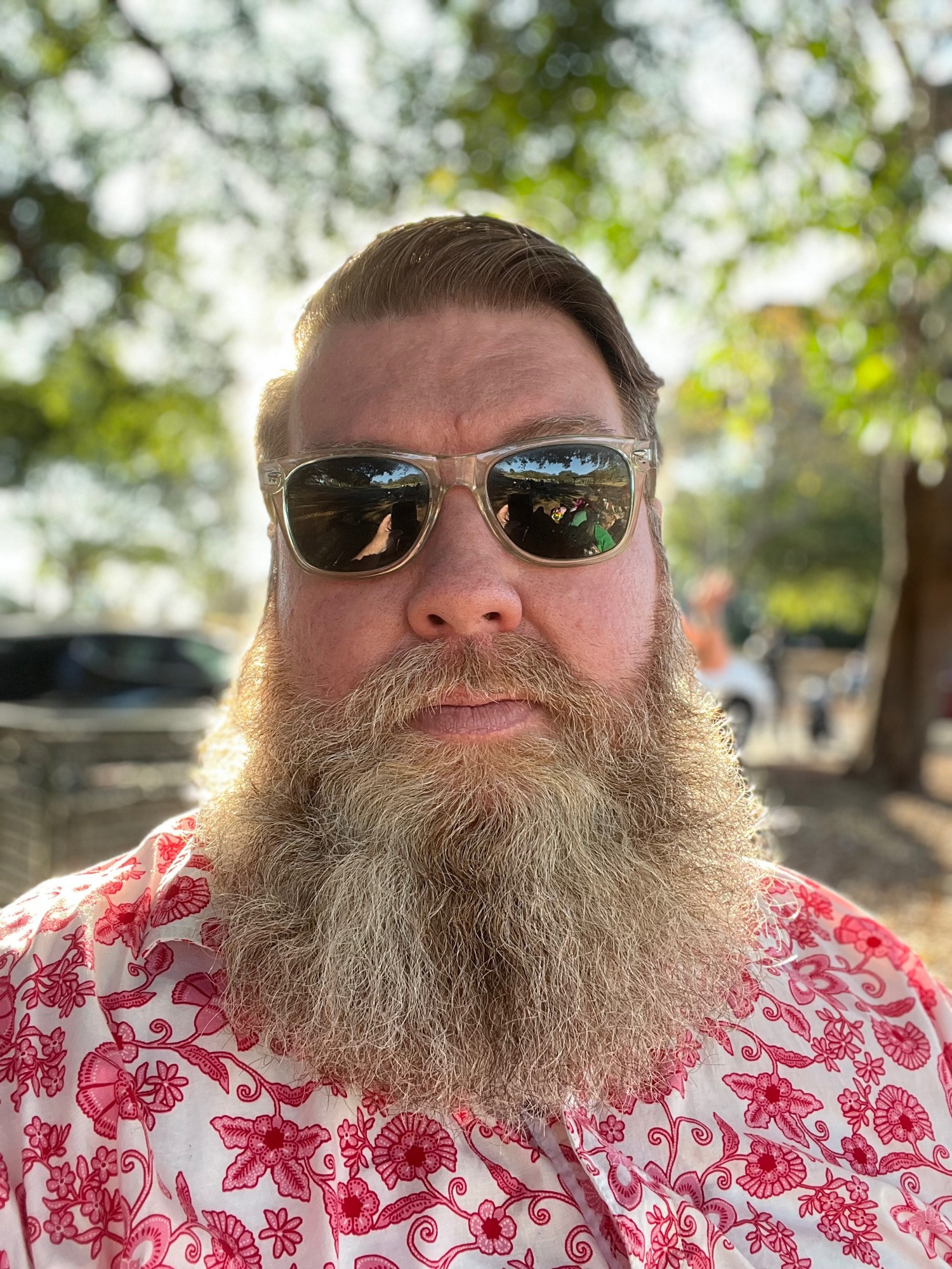 The account holder — white, bearded and 47 — sitting in the park