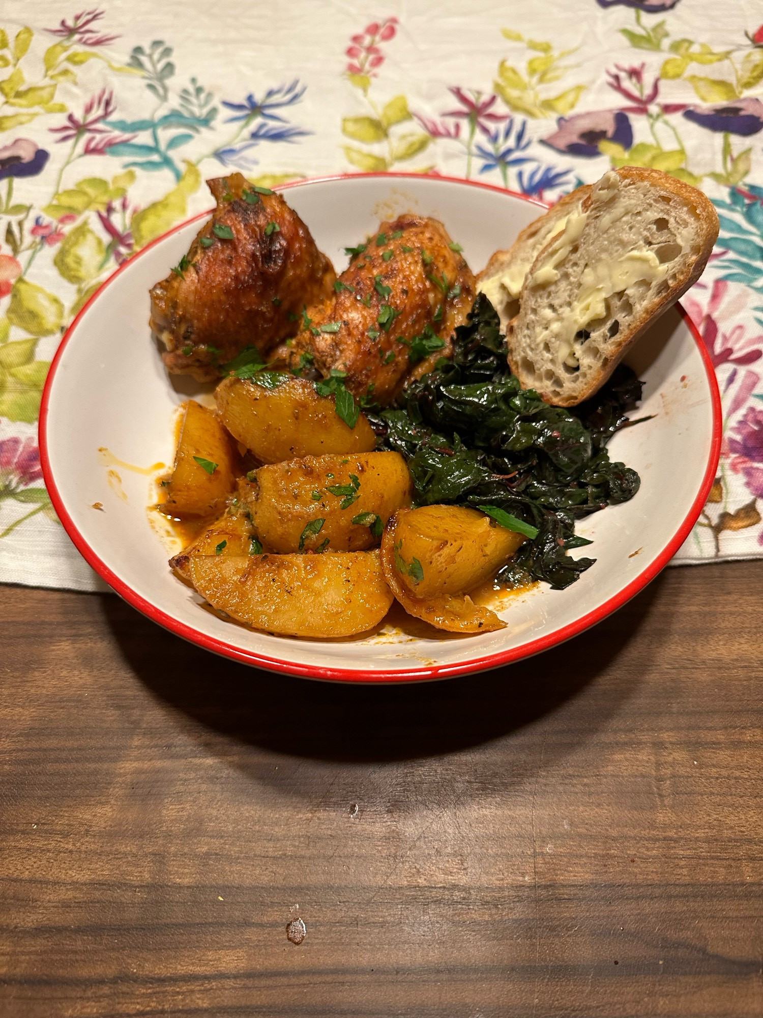 Plate of chicken, potatoes, garlicky chard, and bread looking mighty tasth