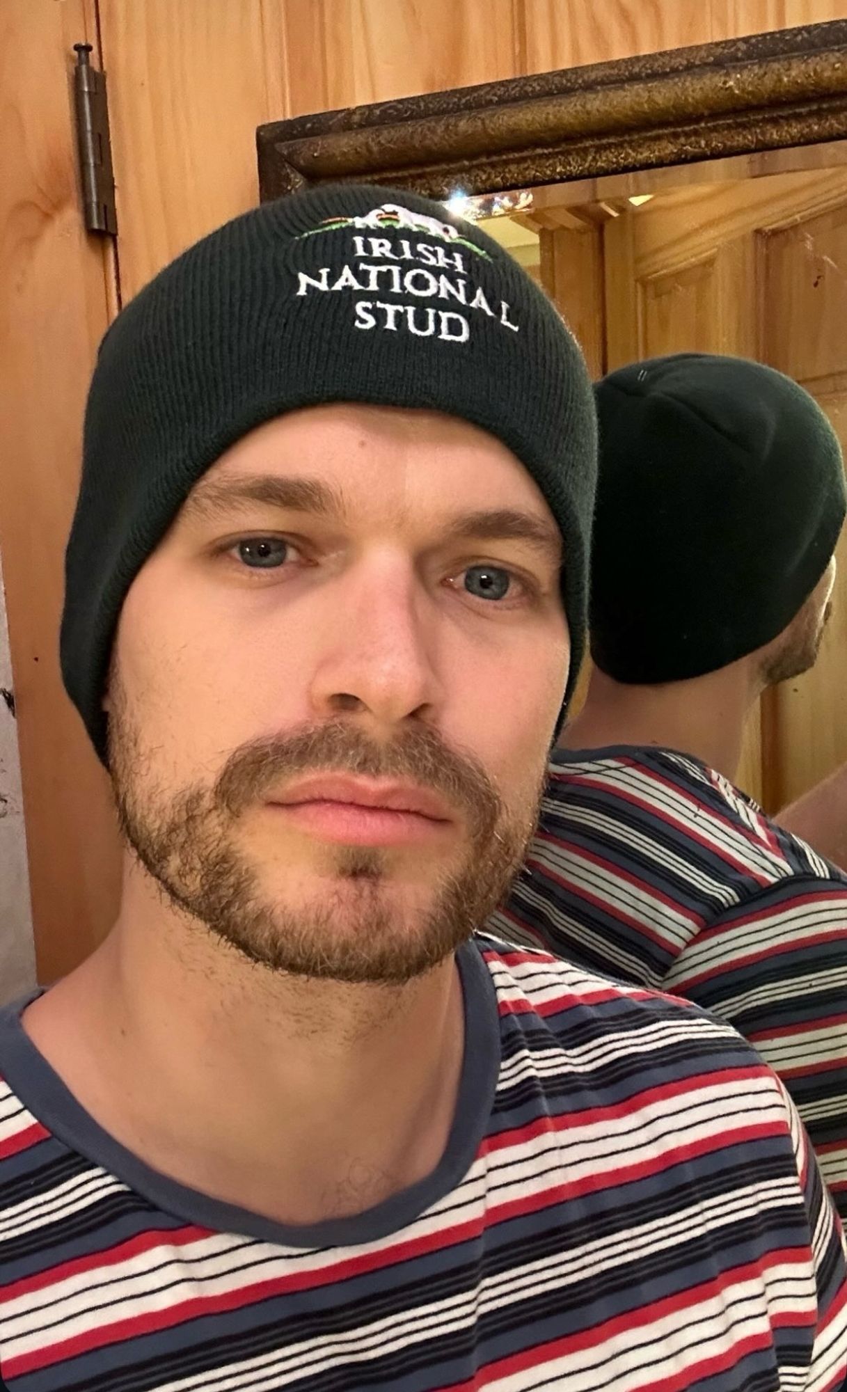 i call him the most handsome man in north america, but he usually goes by will. a young, beautiful man with high cheekbones, gently sad eyes, big lips and tasteful facial hair models a knit wool cap with embroidery: "IRISH NATIONAL STUD" and you know that hat ain't lyin.