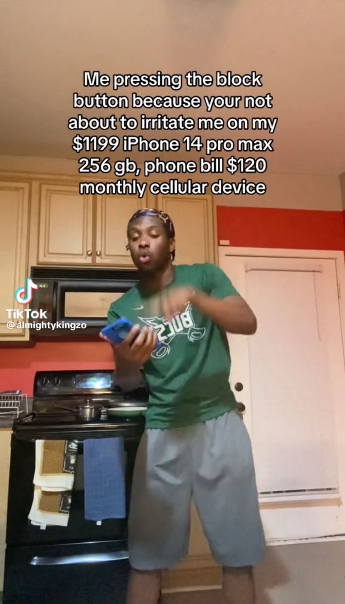 tiktok screengrab of man quickly hitting a button on his phone with text overlay: "Me pressing the block button because your not about to irritate me on my $1199 iPhone 14 pro max 256 gb, phone bill $120 monthly cellular device"