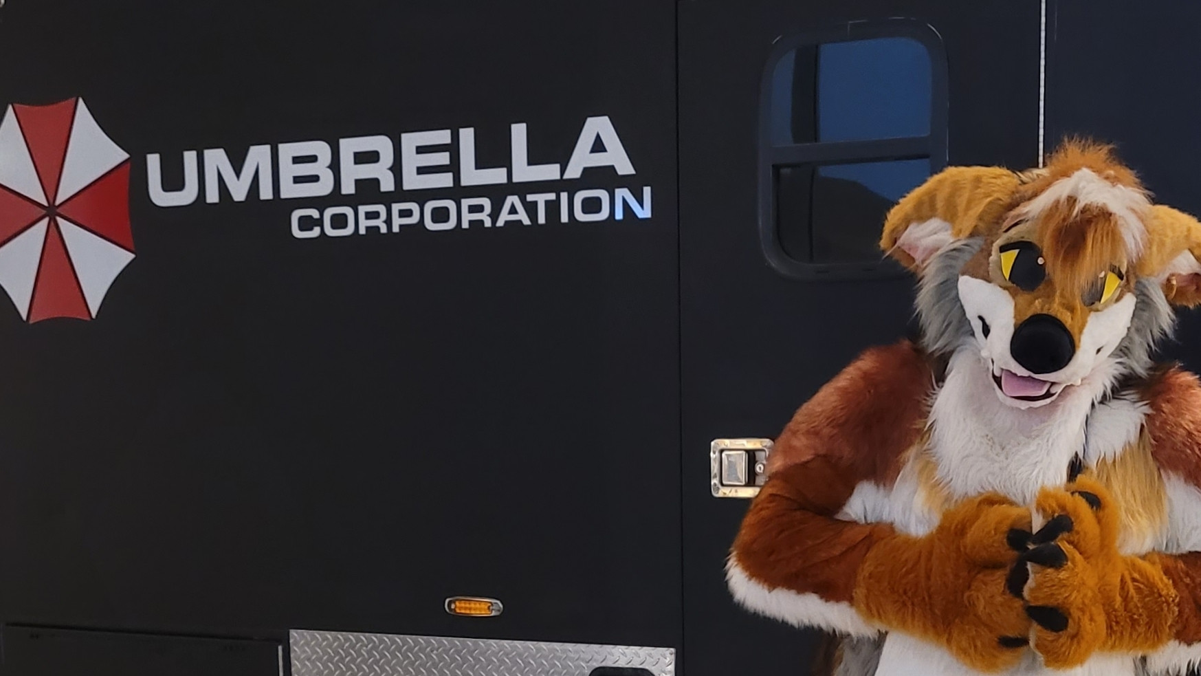 Kross Coyote (Fursuit).  In front of a Umbrella Corp. Response Vehicle 