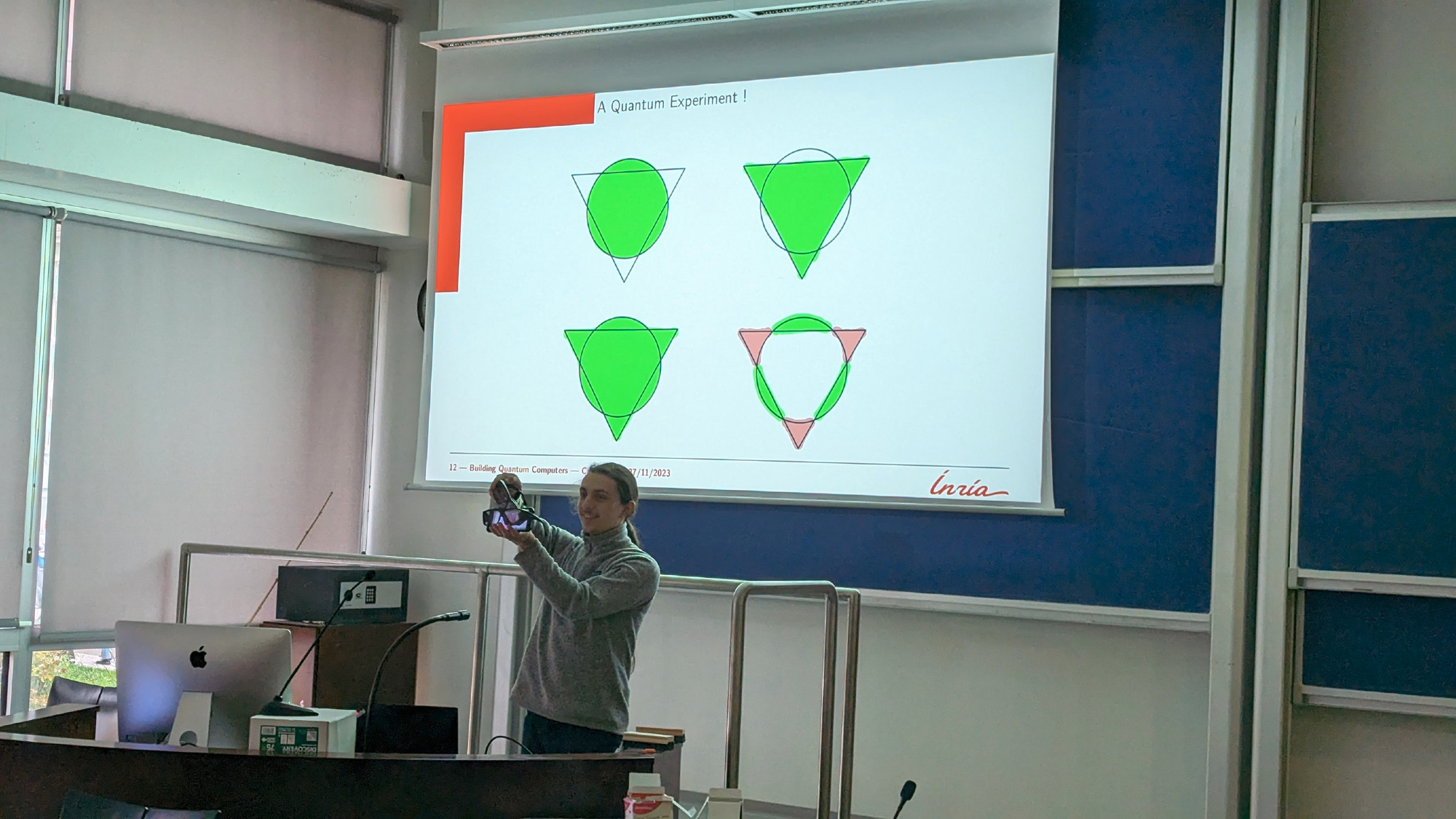 Myself holding a smartphone and two pairs of 3D glasses in front of it to measure the polarization of the light emitted by the smartphone screen.