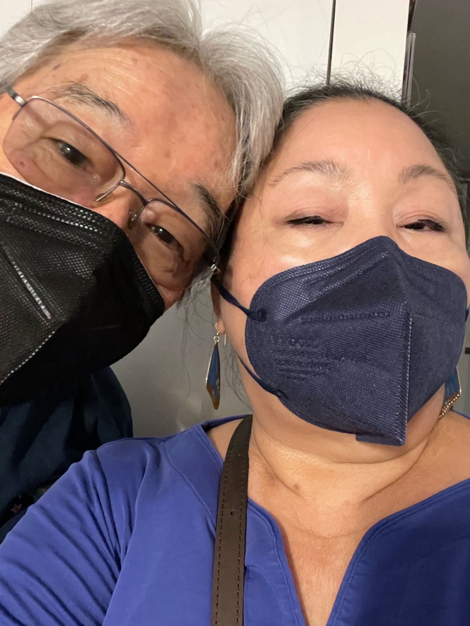 Man wearing N95 mask and woman wearing KN95.