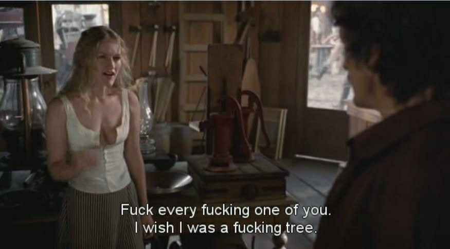 Screenshot from Deadwood, with the character Trixie saying "Fuck every fucking one of you. I wish I was a fucking tree." before storming out