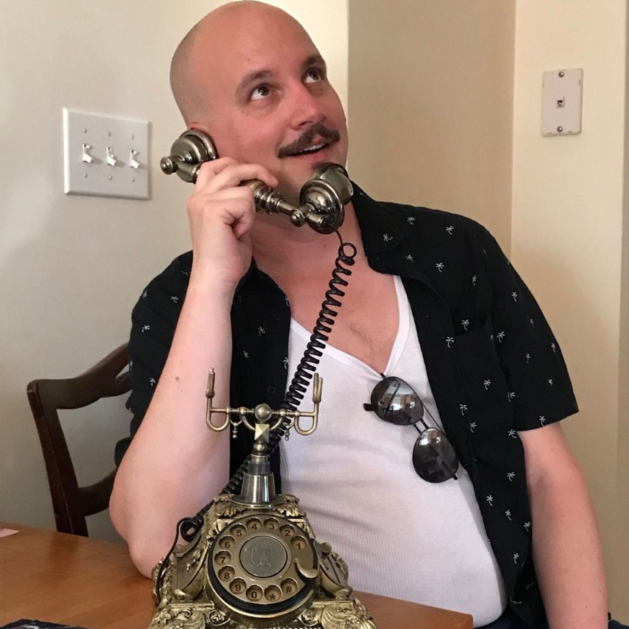 me talking into a novelty old timey rotary phone