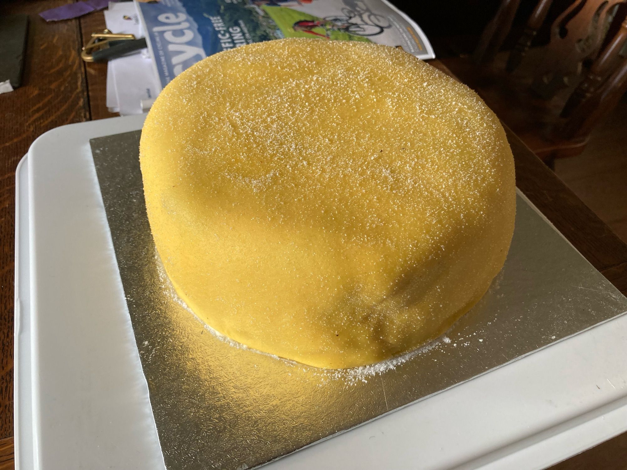 A large yellow, circular cake