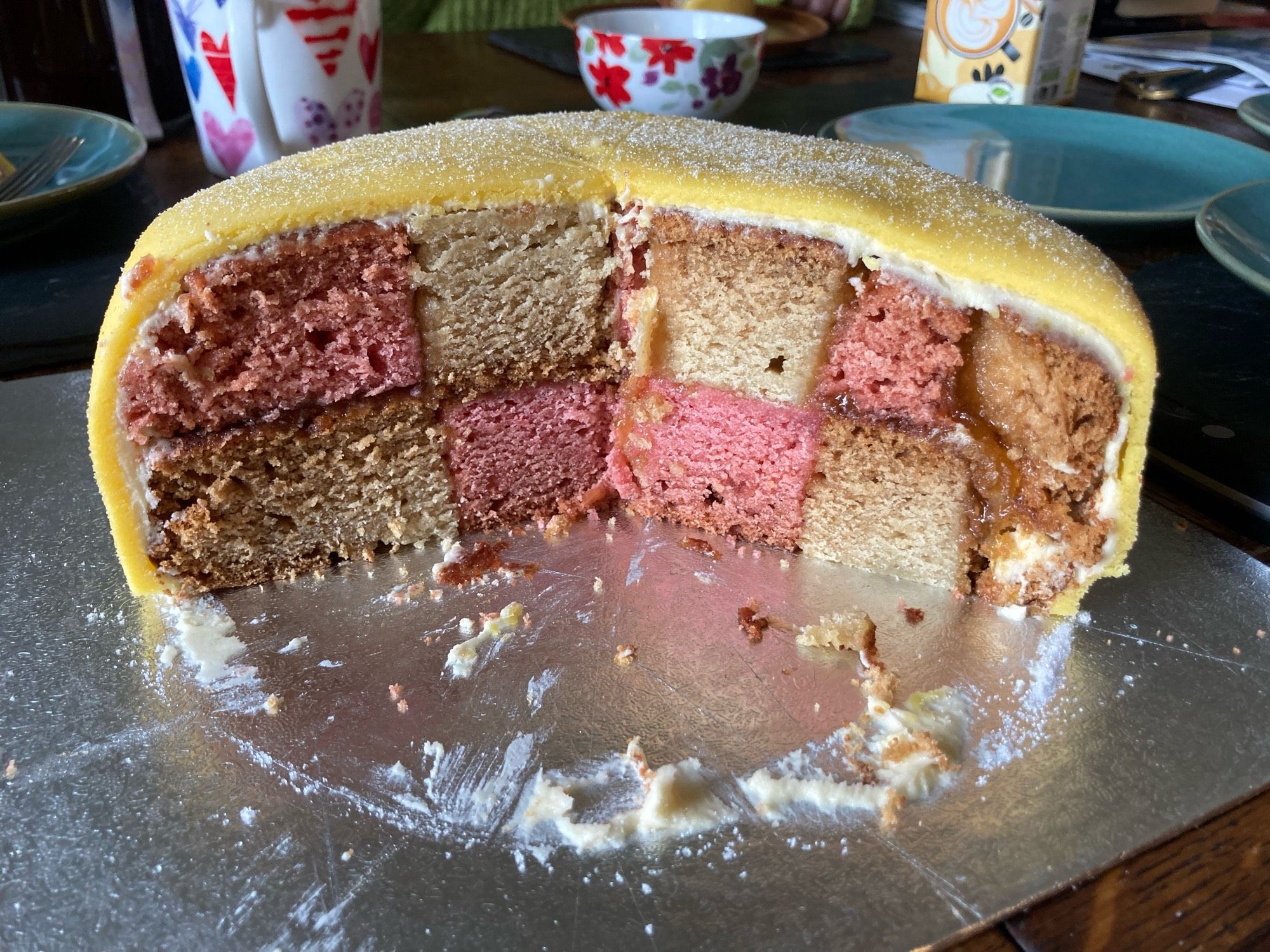 The inside of the cake, featuring a pink and white checkerboard pattern