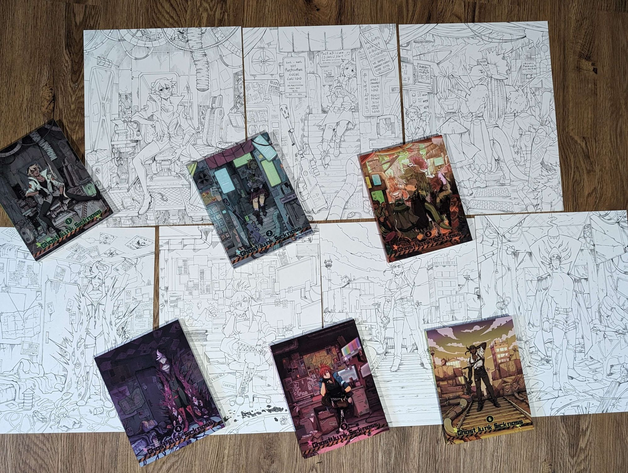 spread of books on top of ink drawings