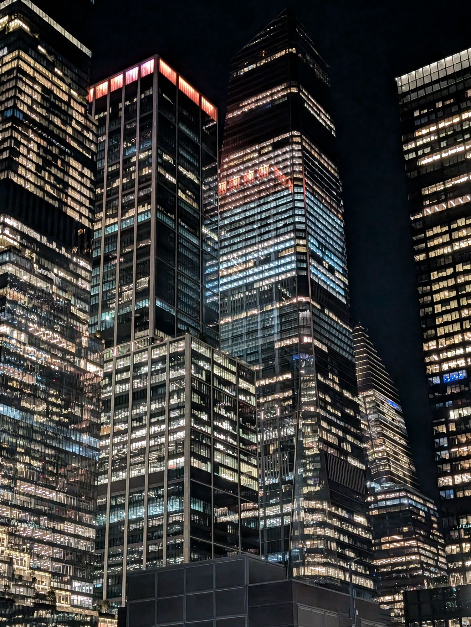 Many tall and brightly lit buildings