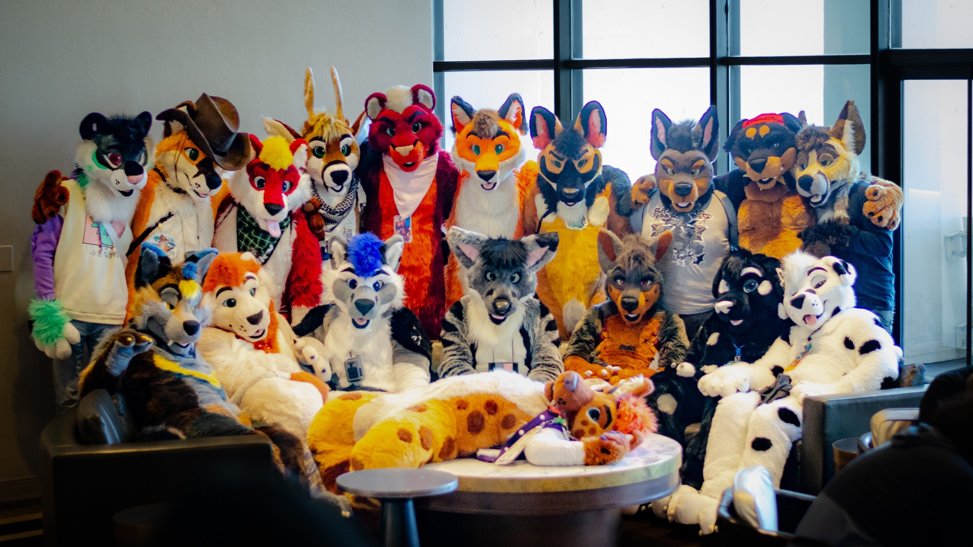 A "family portrait" with a hyena lying on the table in a hotel lobby