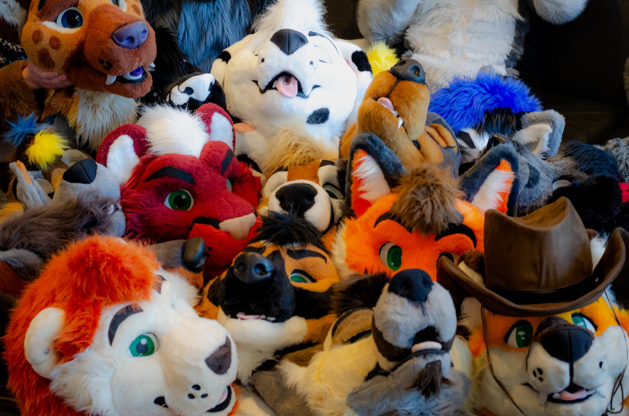 A massive pile of fursuit heads