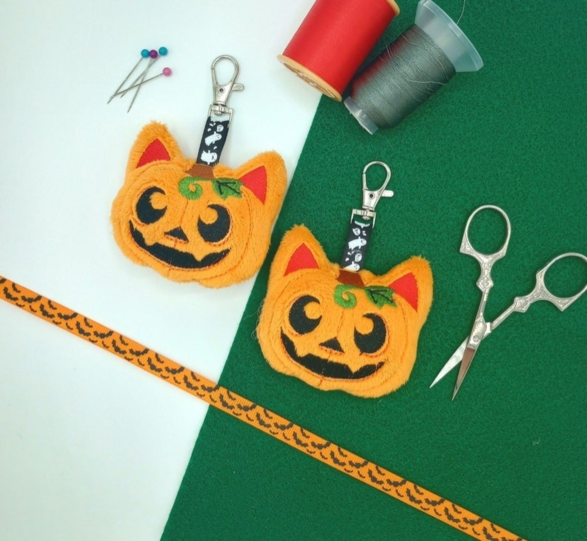 Two handmade Pumpkin Cat plushie keychains.