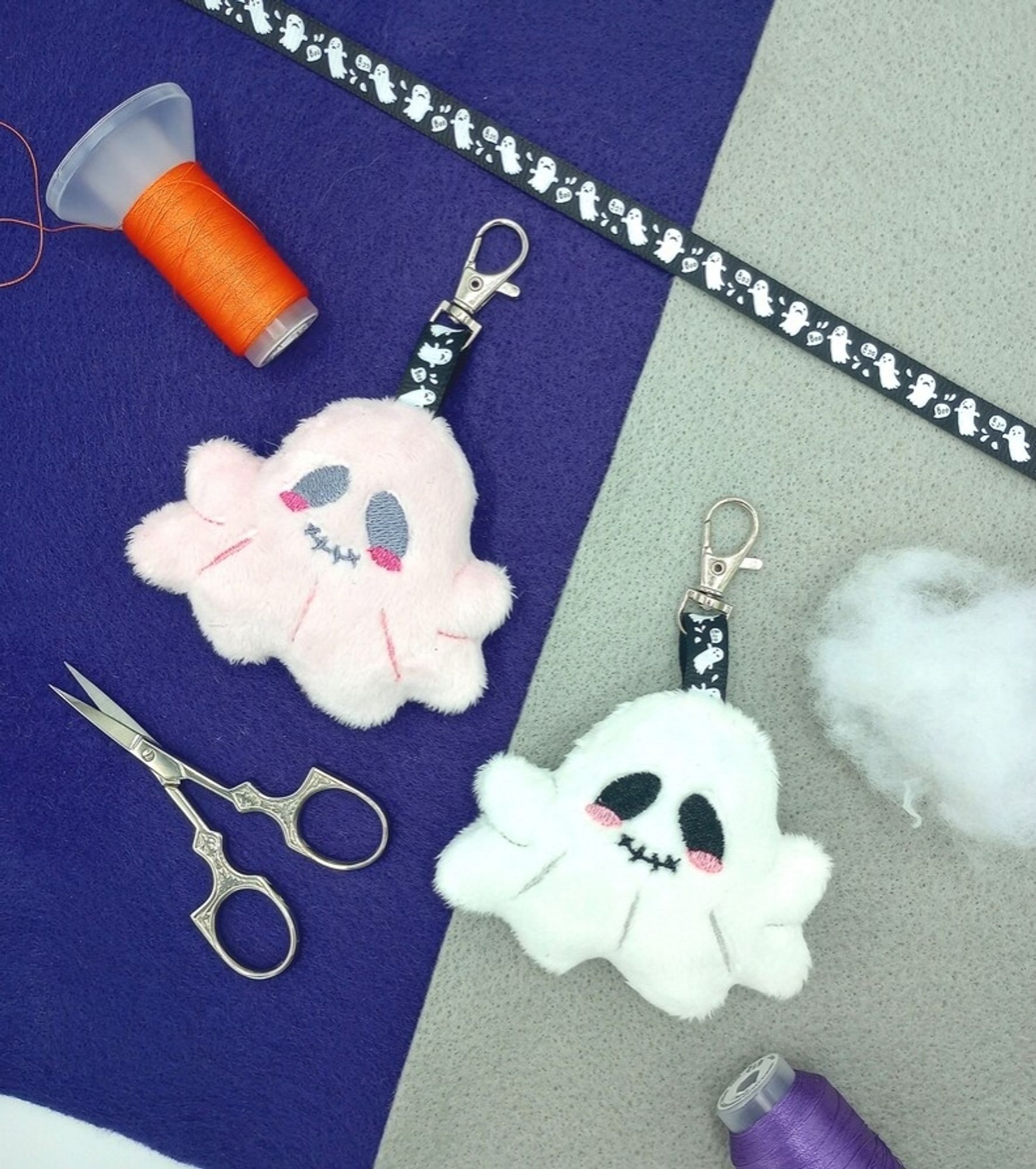 Two handmade kawaii ghost plush keychains.