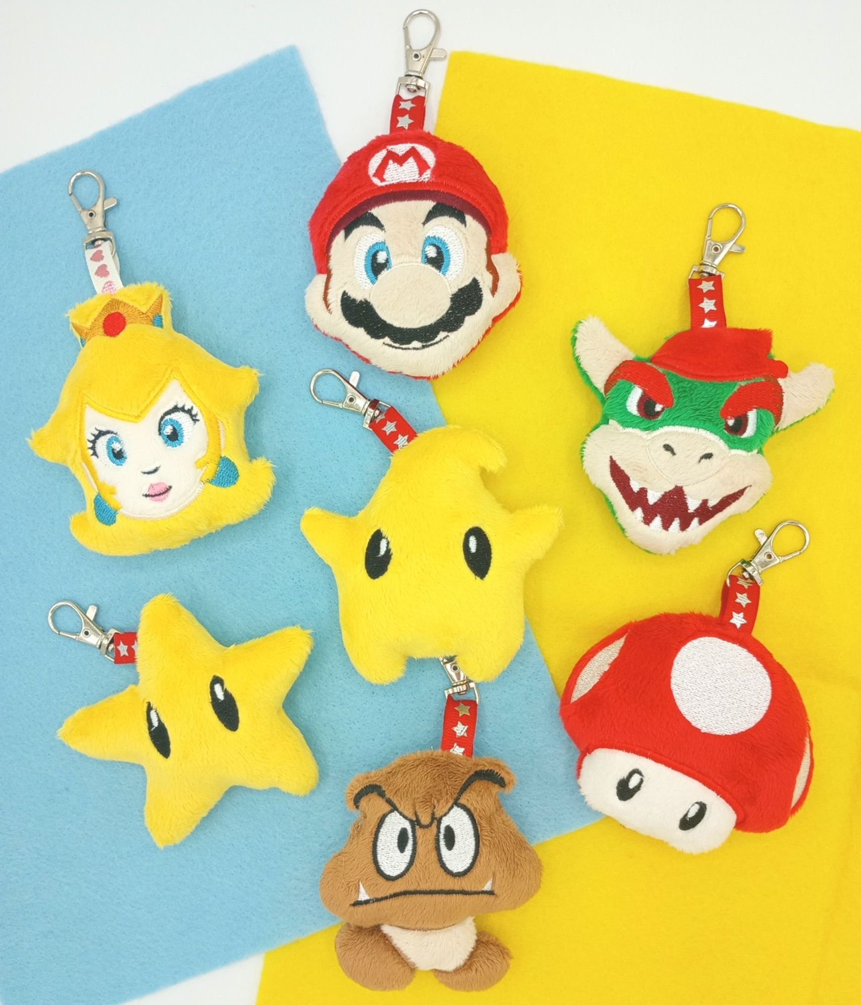 A collection of handmade Super Mario plush keychains.