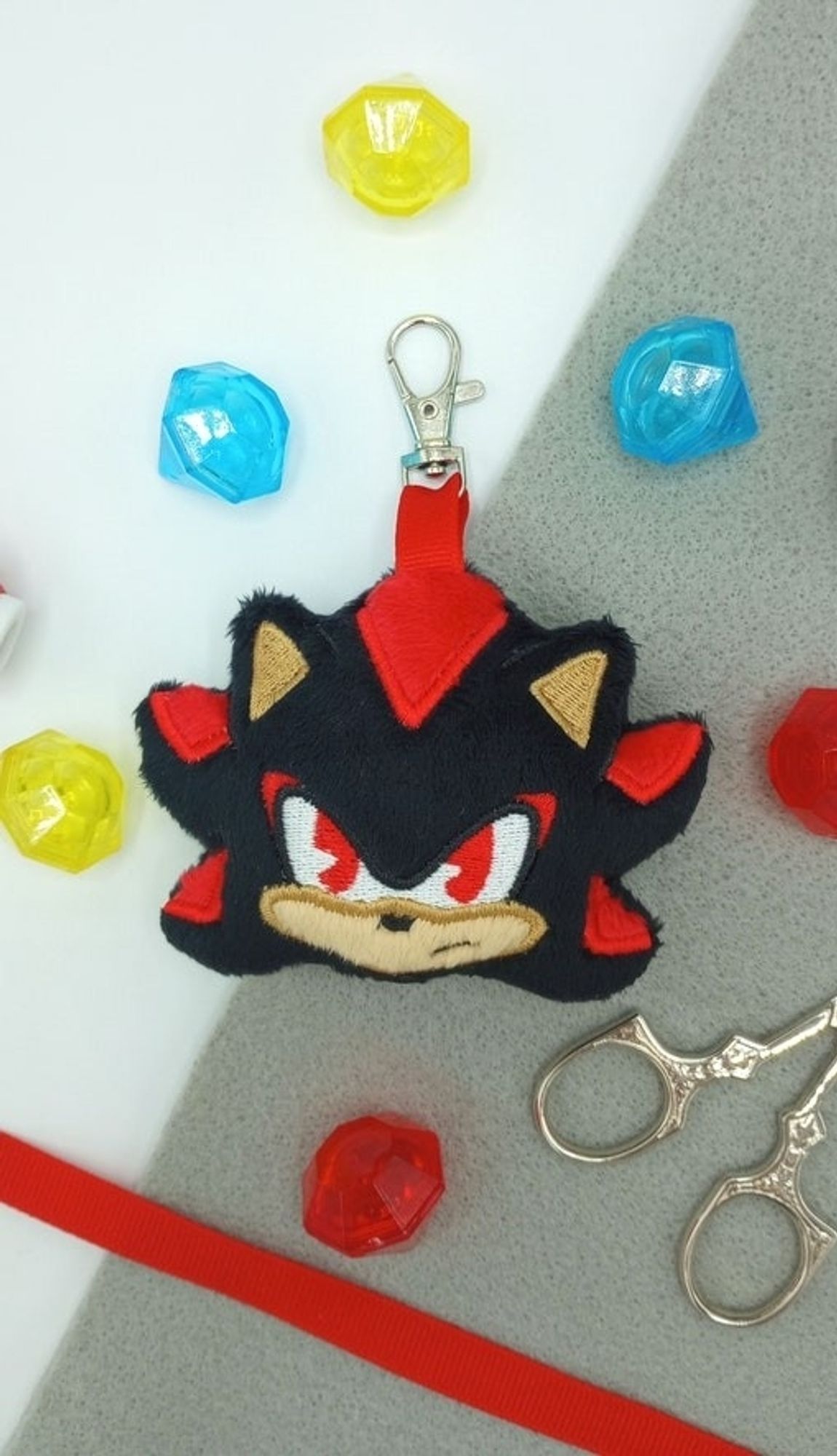 A handmade Shadow the Hedgehog plushie keychain.