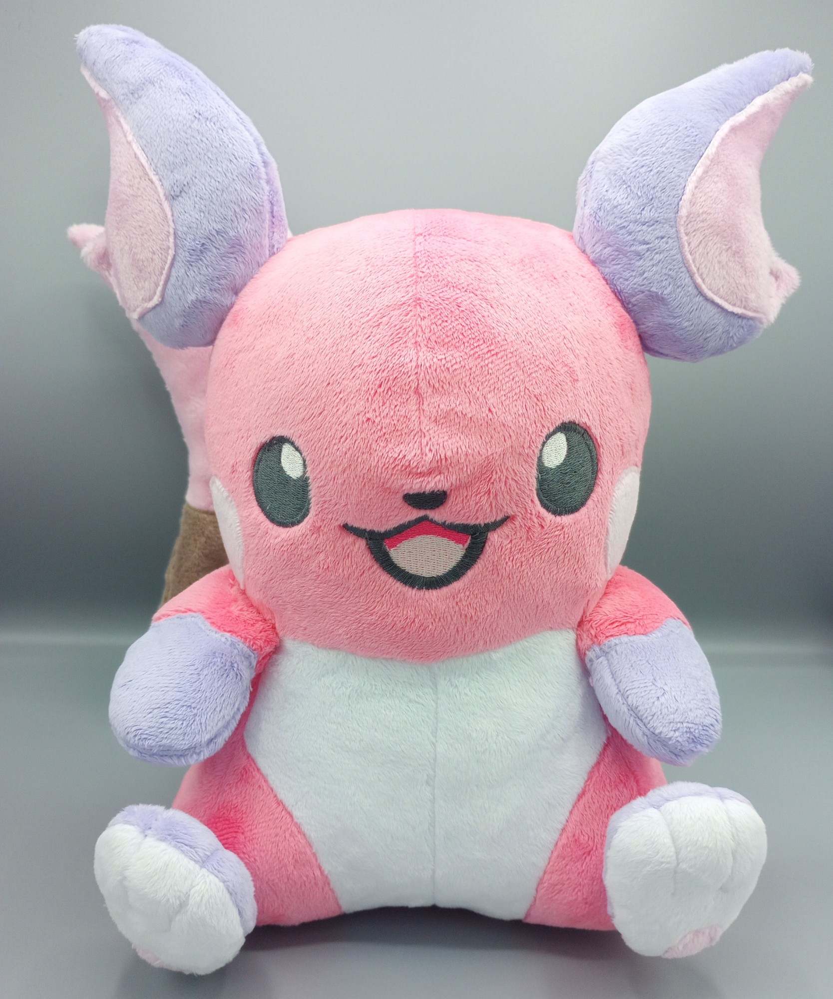 A handmade pink Raichu plushie from Pokemon.