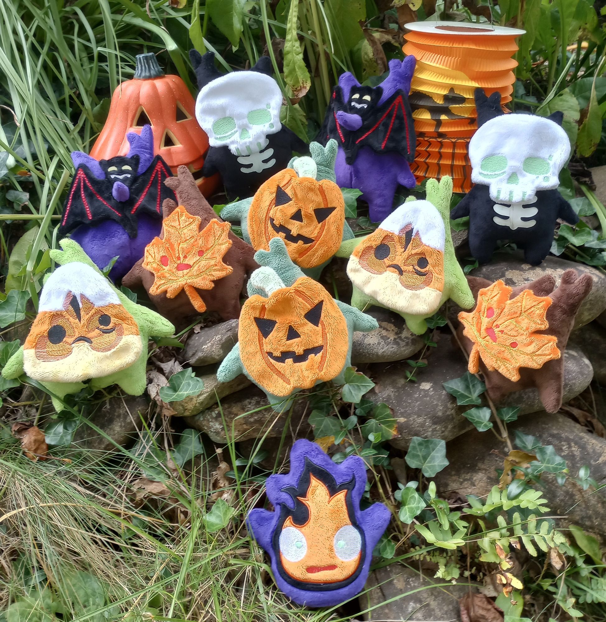 A collection of handmade Halloween themed Korok plushies from the Legend of Zelda.