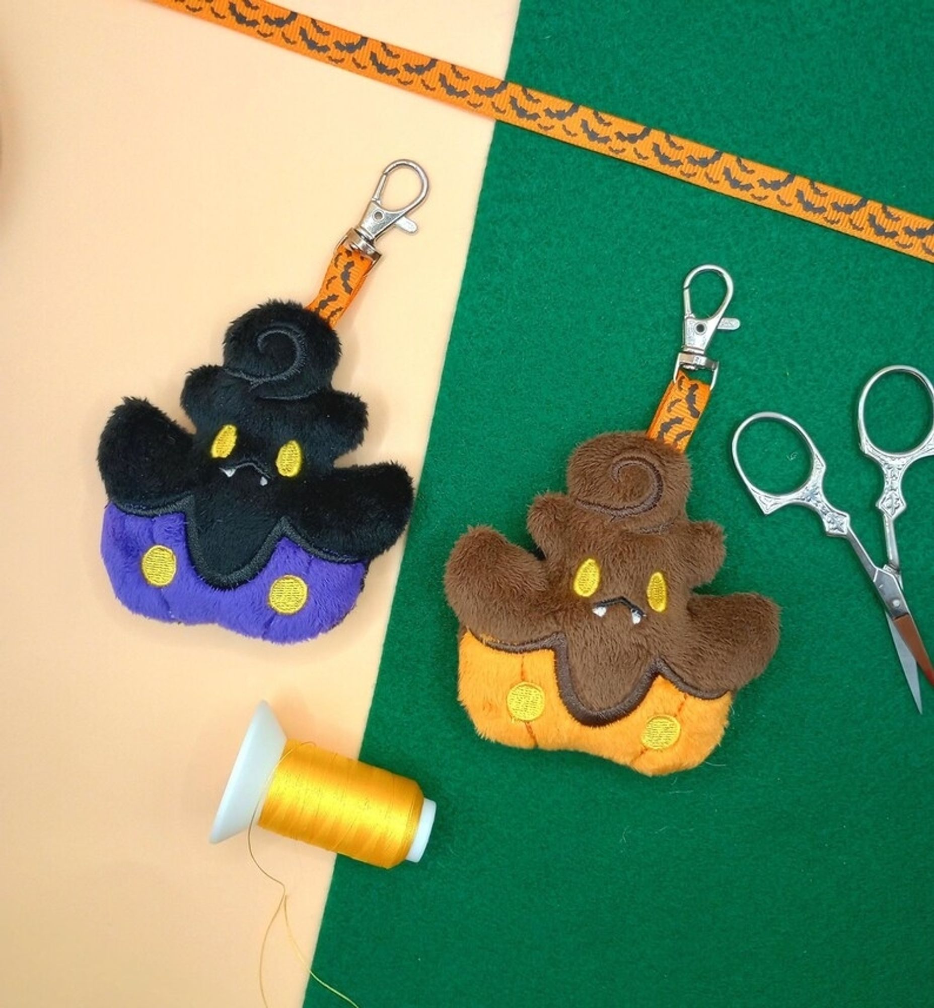 Two handmade Pumpkaboo plushie keychains from Pokemon.