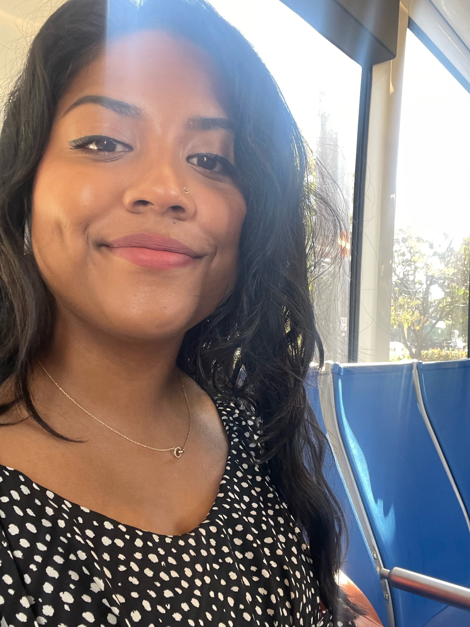 Aurin taking a selfie on the lightrail