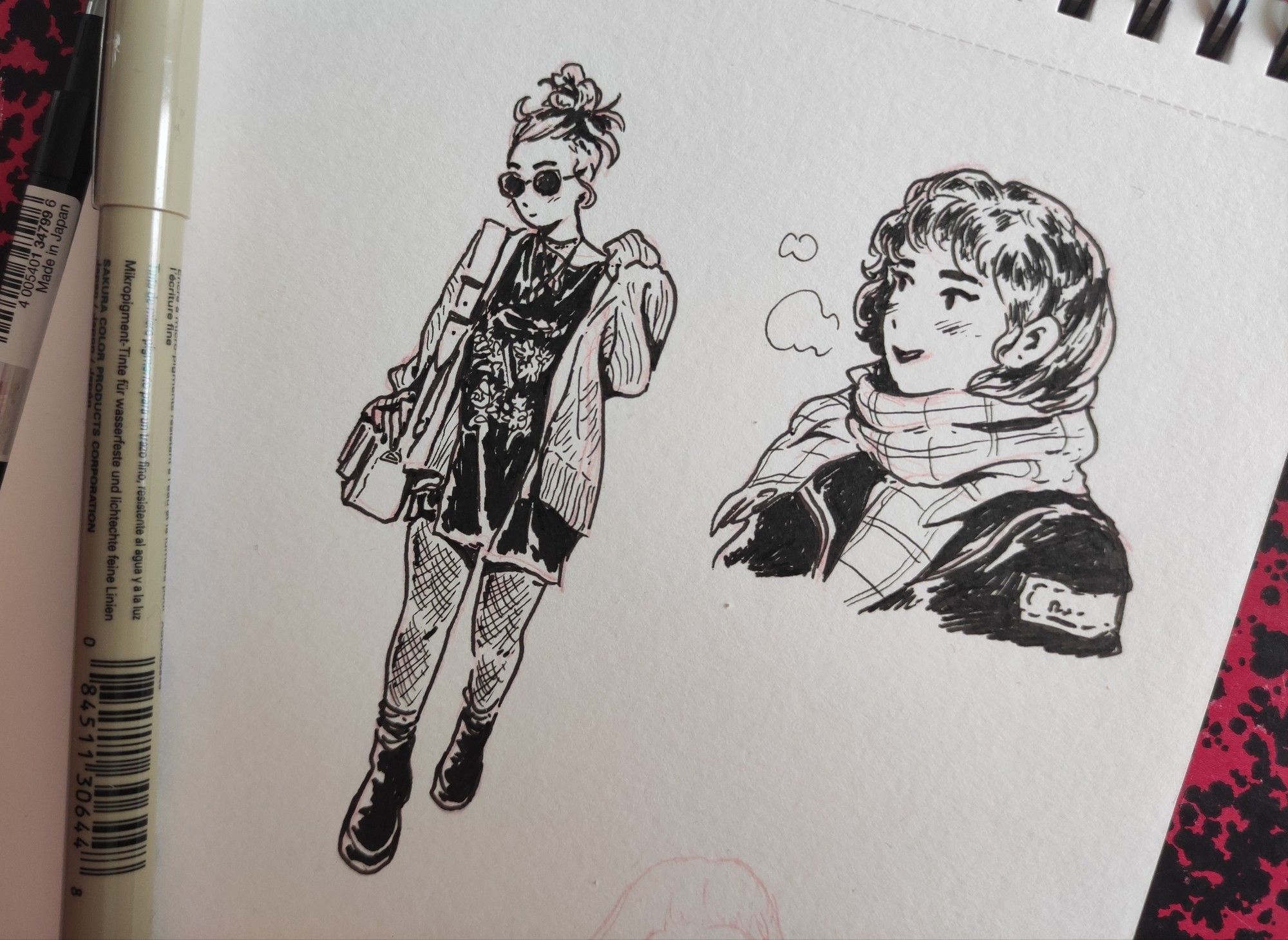 Ink drawings on a sketchbook page
One woman with sunglasses, wearing tights and big shoes, walking
Head and shoulders of an other woman wearing a scarf