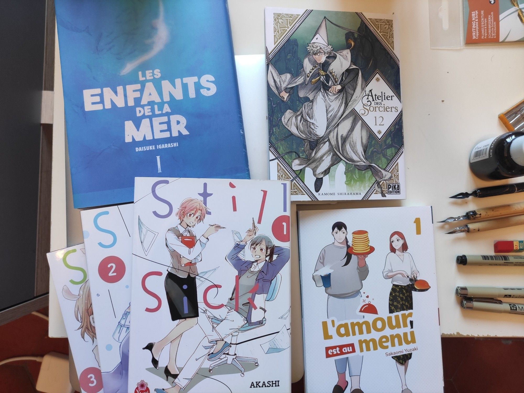 Pic of the mangas I bought : Children of the sea, Witch Hat Atelier, Still Sick and She Loves to Cool, & She Loves to Eat