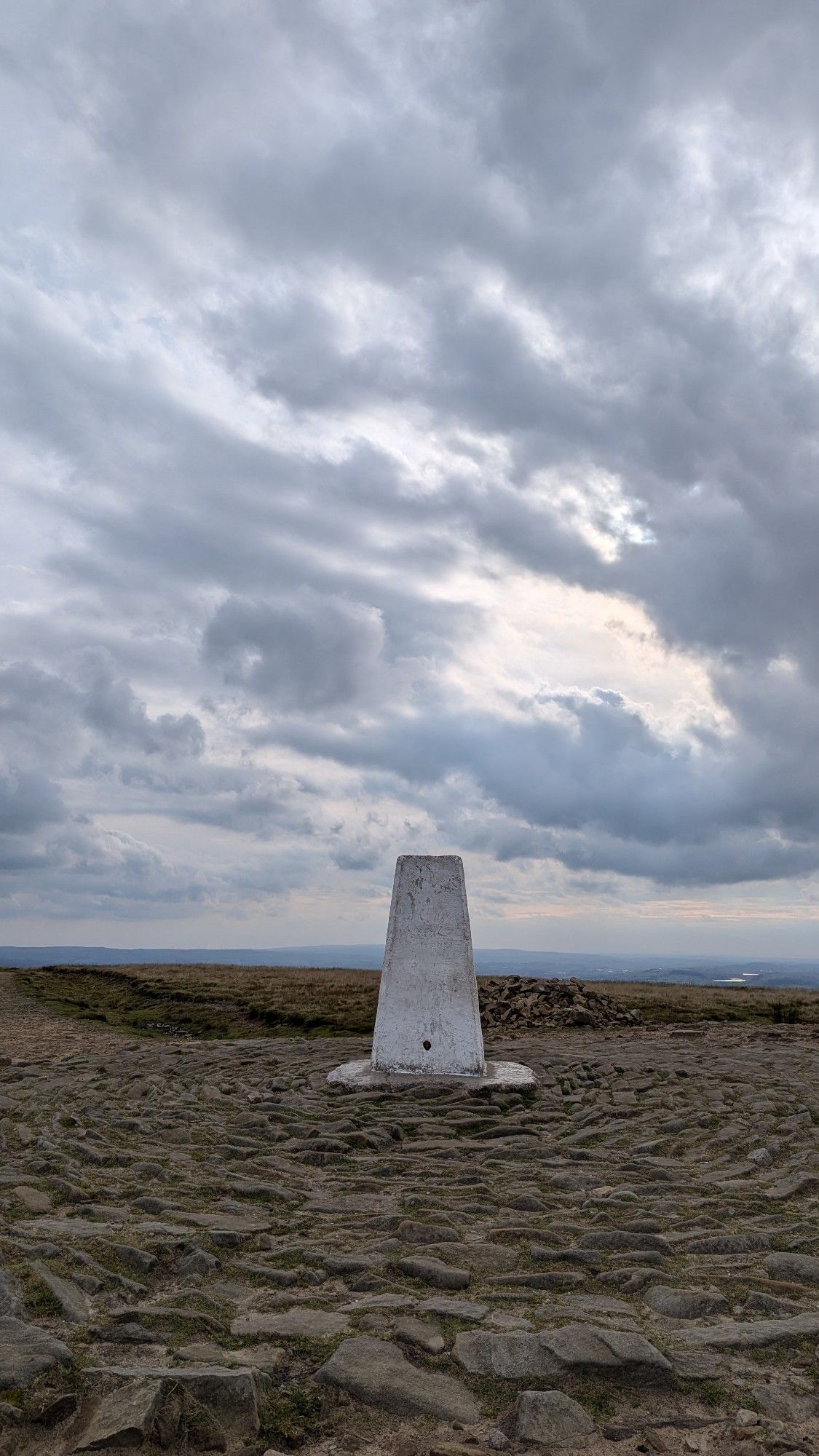 The beacon at the top of Pendle Hill (558m) under a cloudy sky