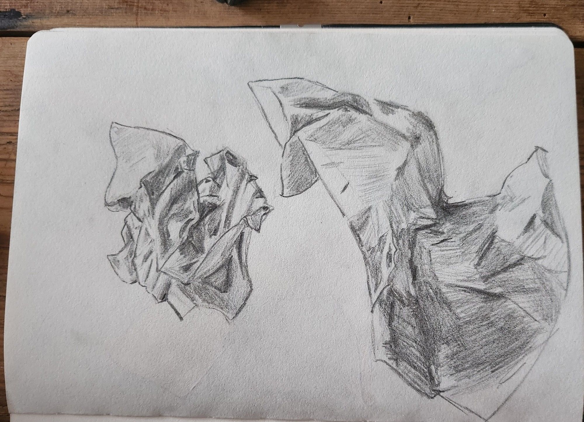 Sketch of crumpled up pieces of paper