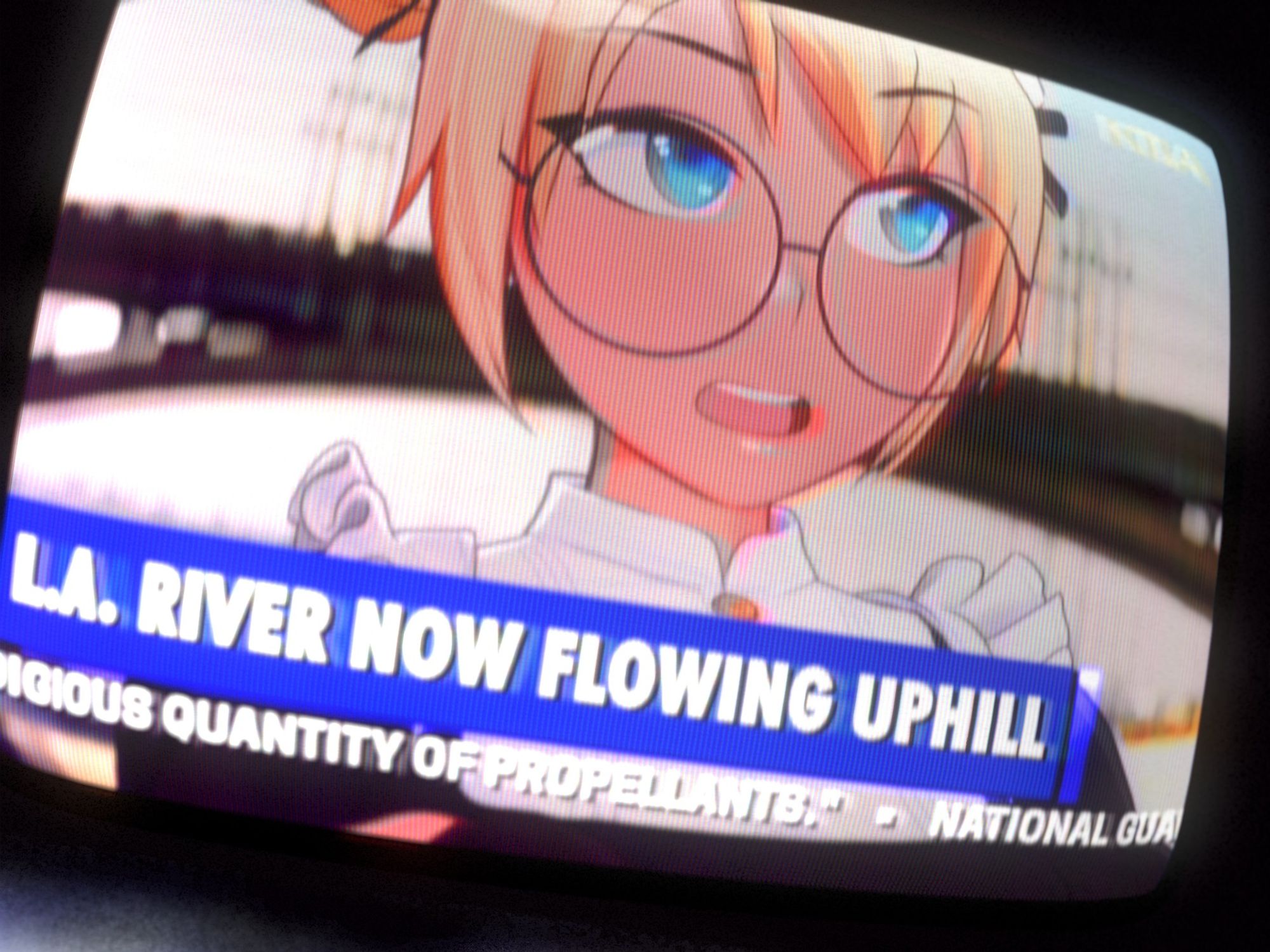 a tv showing a news report, an anime maid is speaking to somebody off camera in front of the 4th street bridge. the ticker reads "L.A. River now flowing uphill" and mentions the national guard and a prodigious quantity of propellants. it is unclear if the maid is a witness, perpetrator or some kind of official.