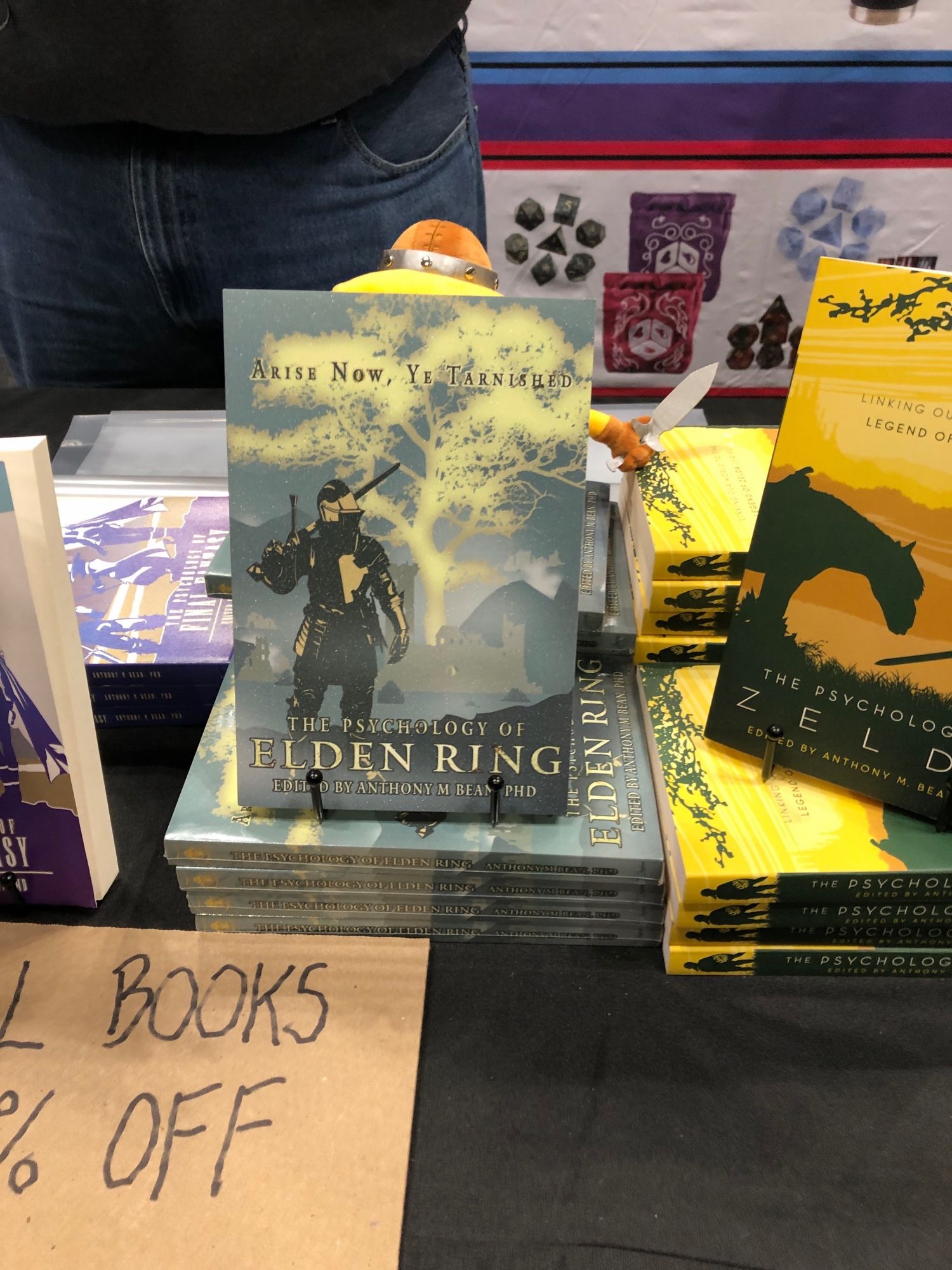 The book “the psychology of Elden ring” on display at New York comic con