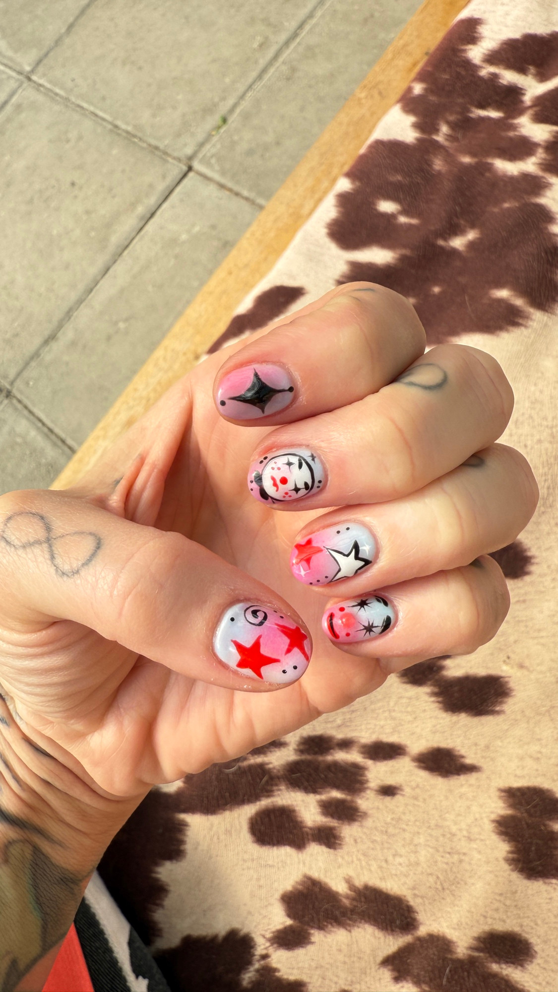Vaughn’s manicure that features clowns and stars. 