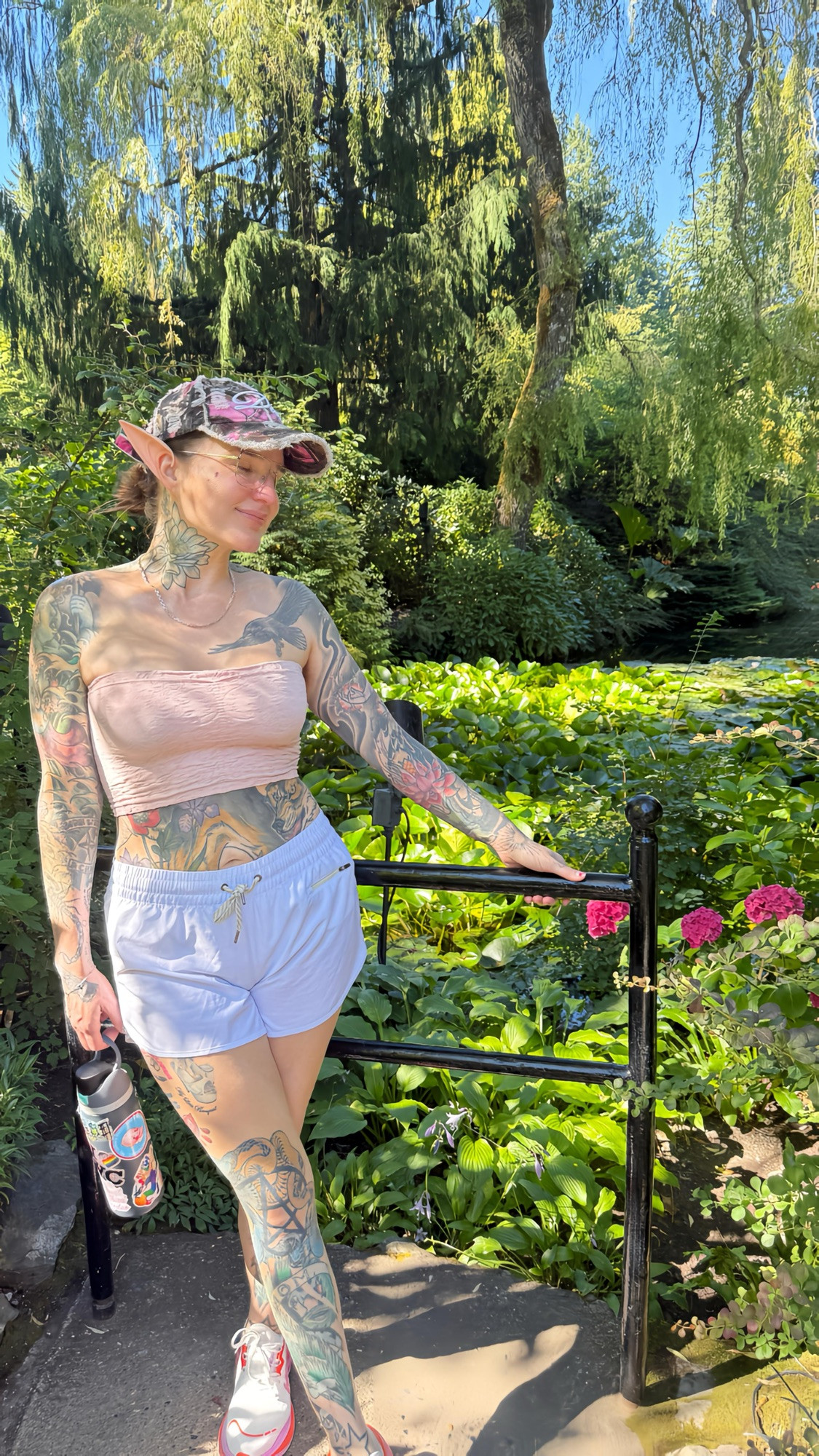 Vaughn wearing costume elf ears while posing for a photo at the Butchart Gardens in Victoria BC