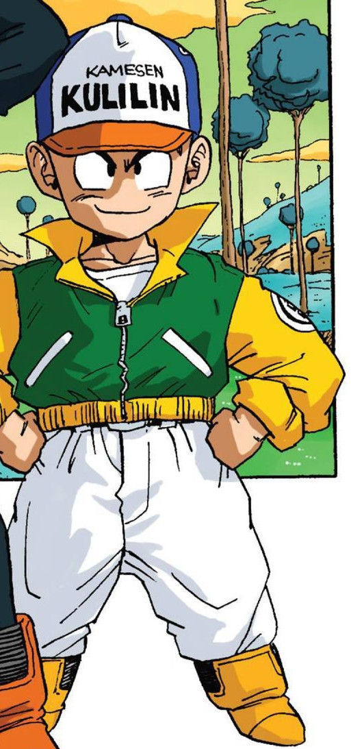 Krillin wearing white pants, sci fi boots, a green and yellow jacket with a popped color and a ball cap that says his name on it