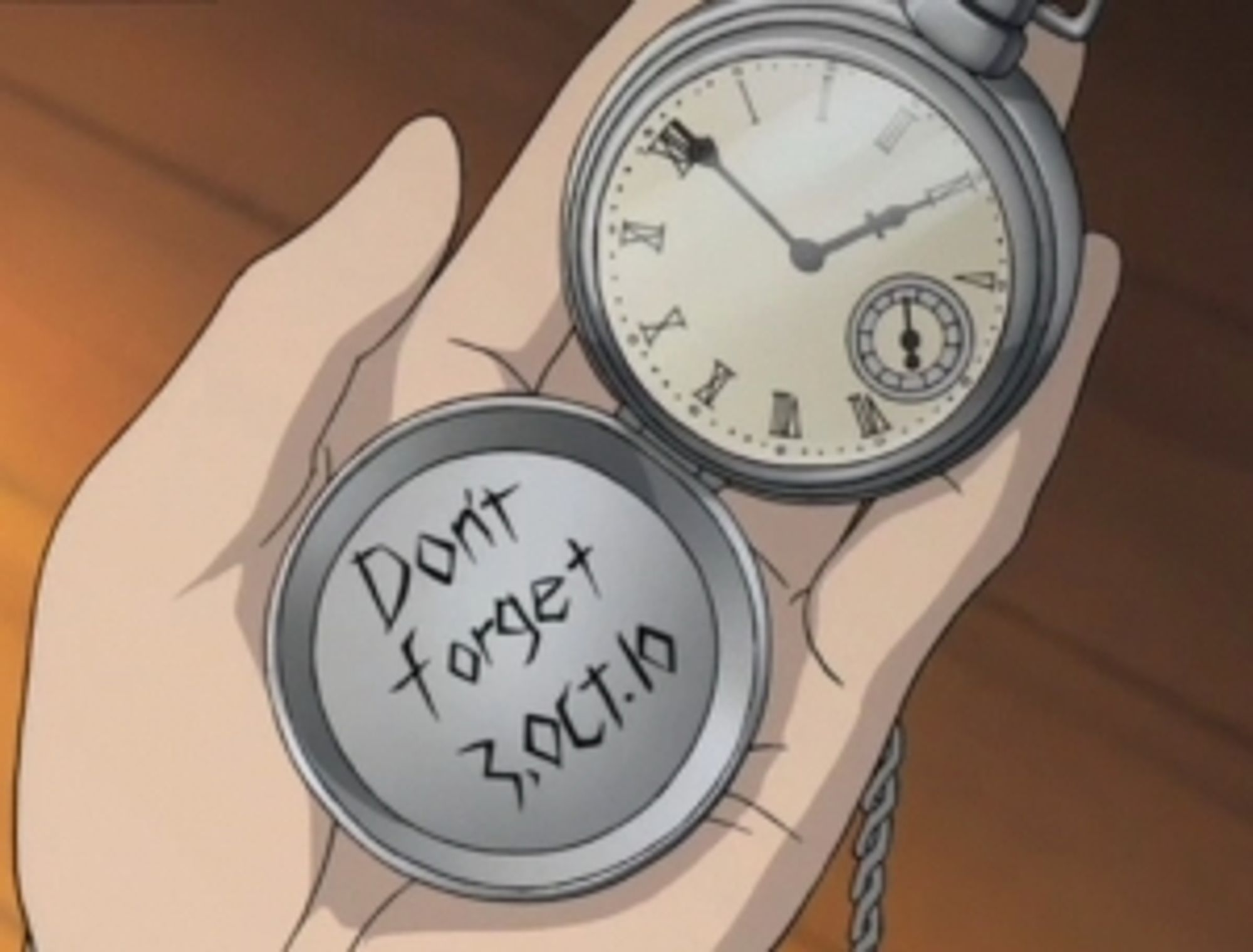 A screenshot from Fullmetal Alchemist with the pocket watch reading DON'T FORGET 3.OCT.10