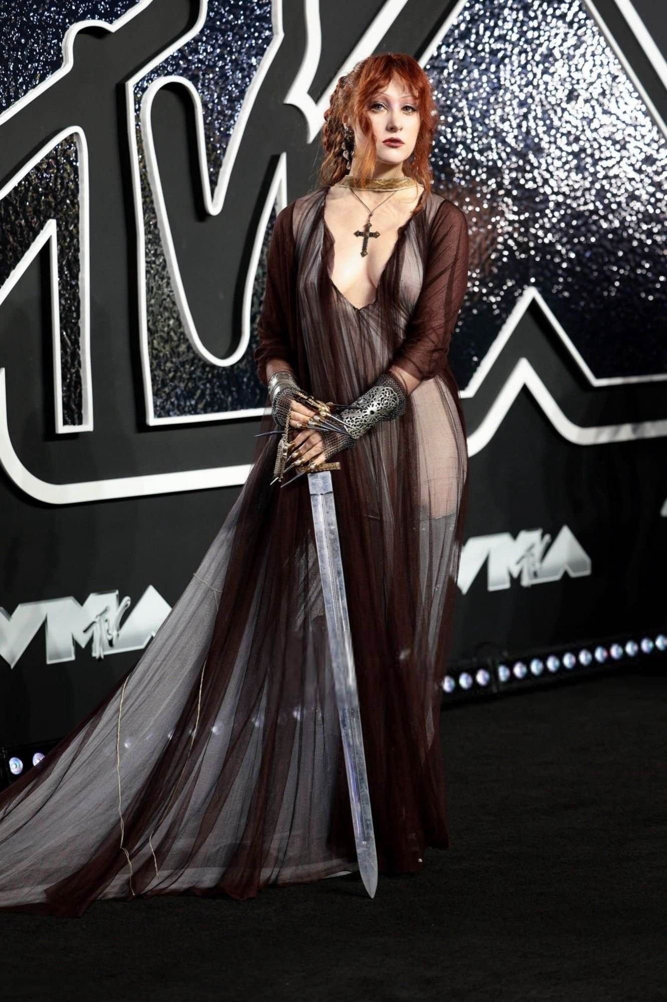 Chappell Roan at the VMAs in a dress with a sword