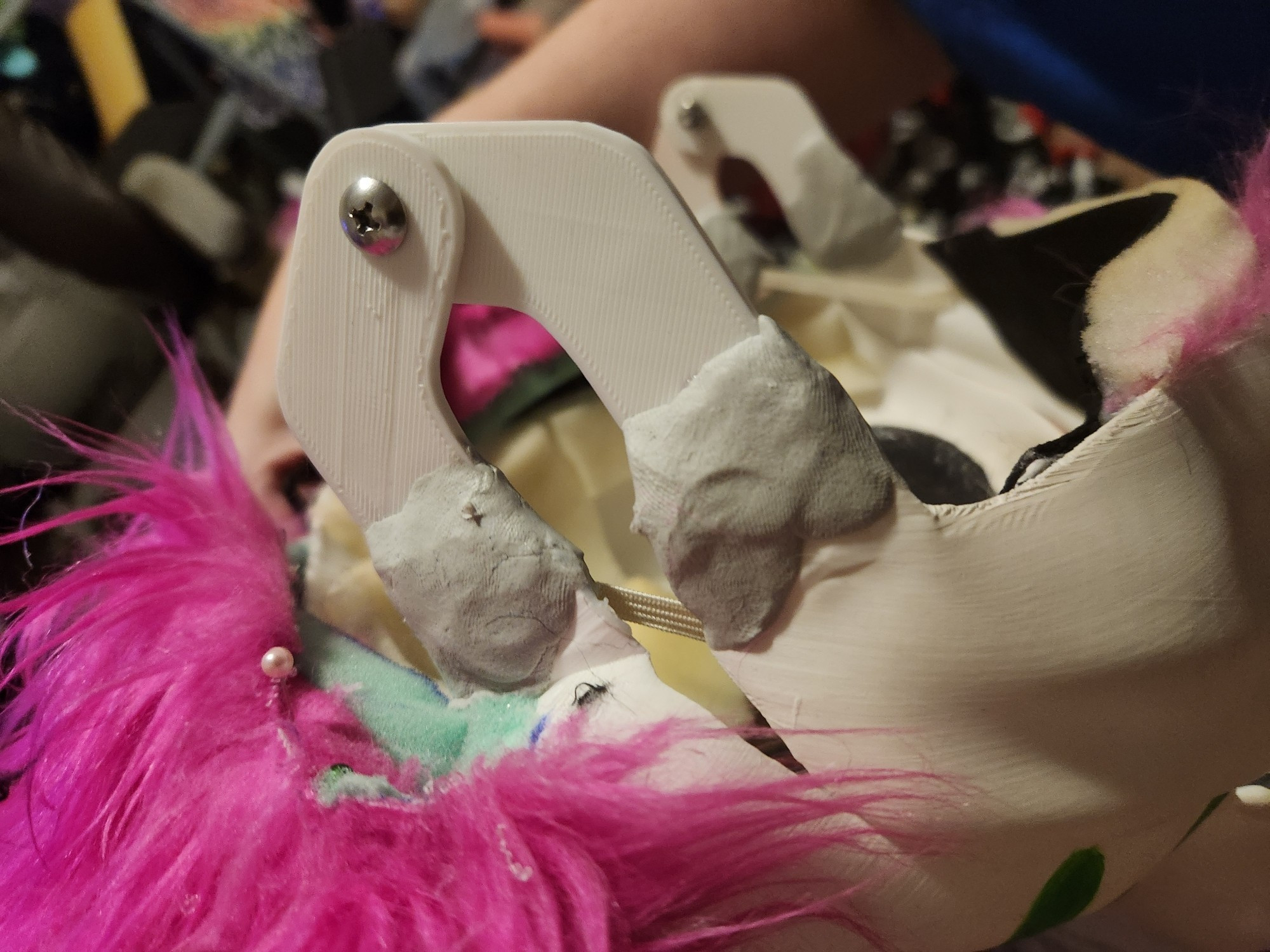 Up close of a skulldog fursuit jaw hinge in a state of repair