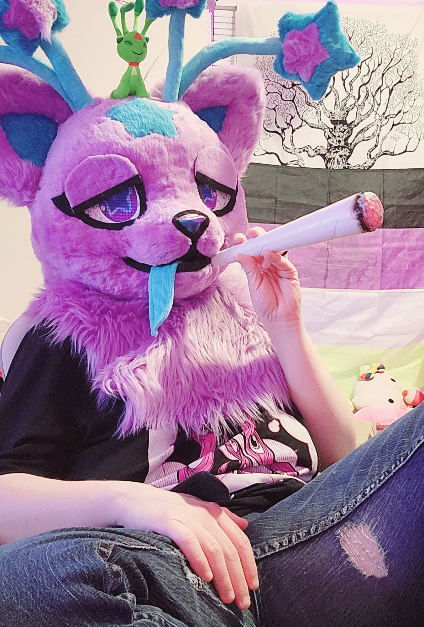 Nova Skystar fursuiter holding a large prop weed joint