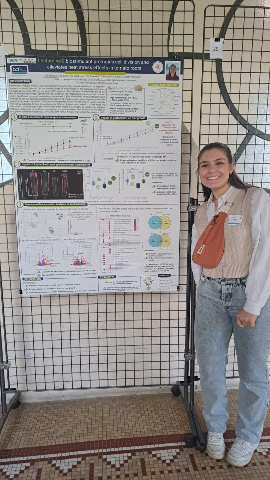 Loé presenting her latest results as a poster