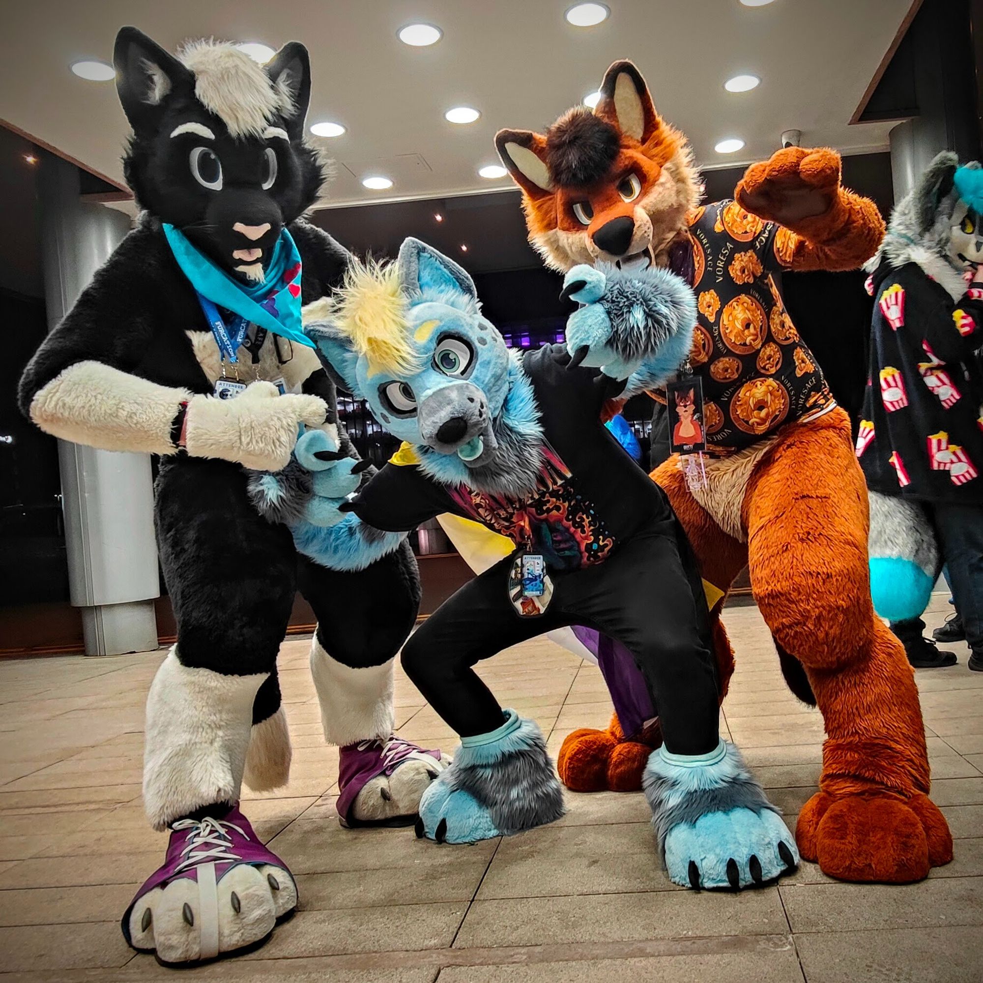 Cute fluffy fursuiters! Flux the cat, Dolby the Hyena and Rusti the Dhole, posing like they're about to drop the hottest album of the year.