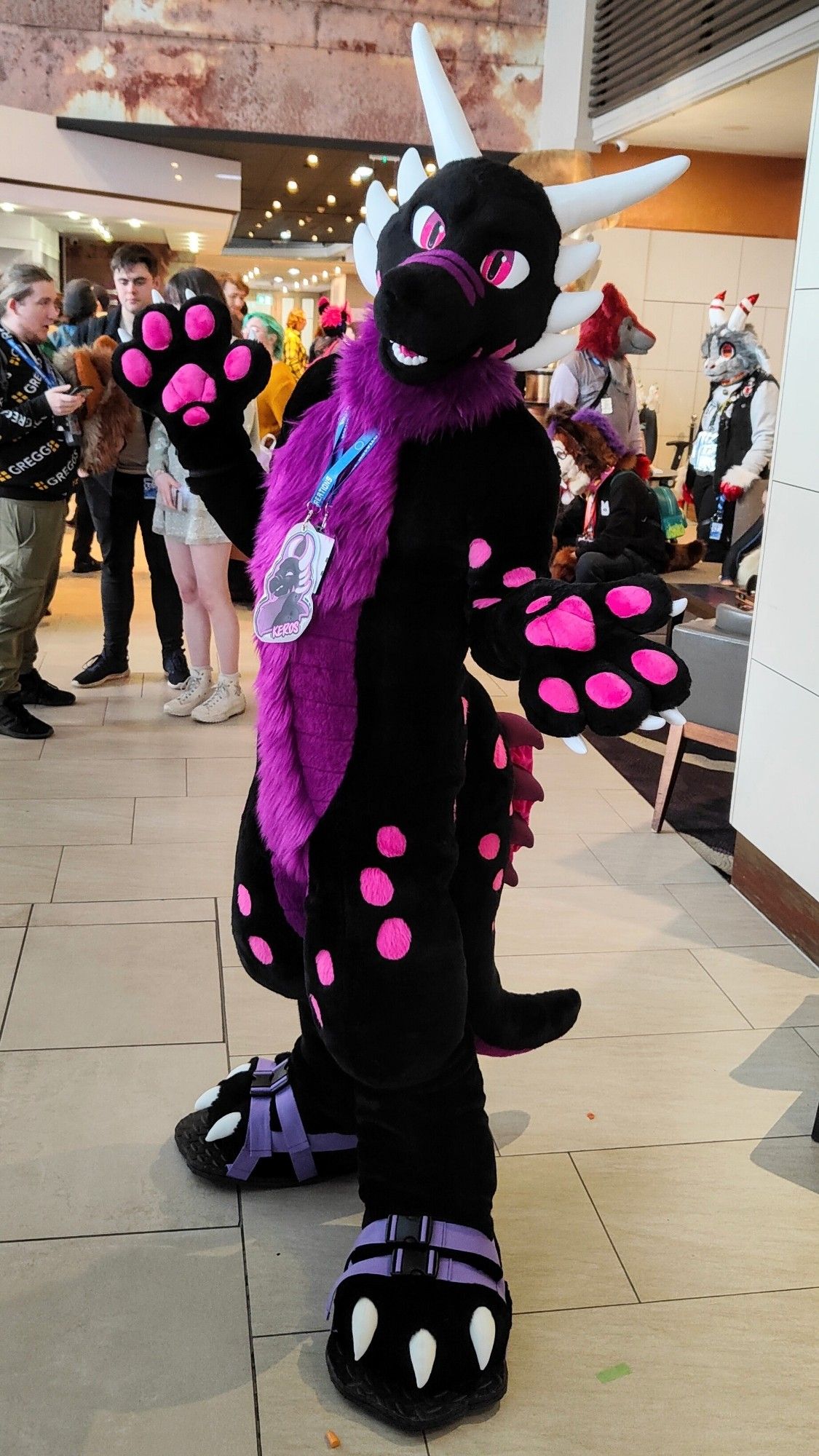 A black and purple dragon fursuit, belonging to Keros