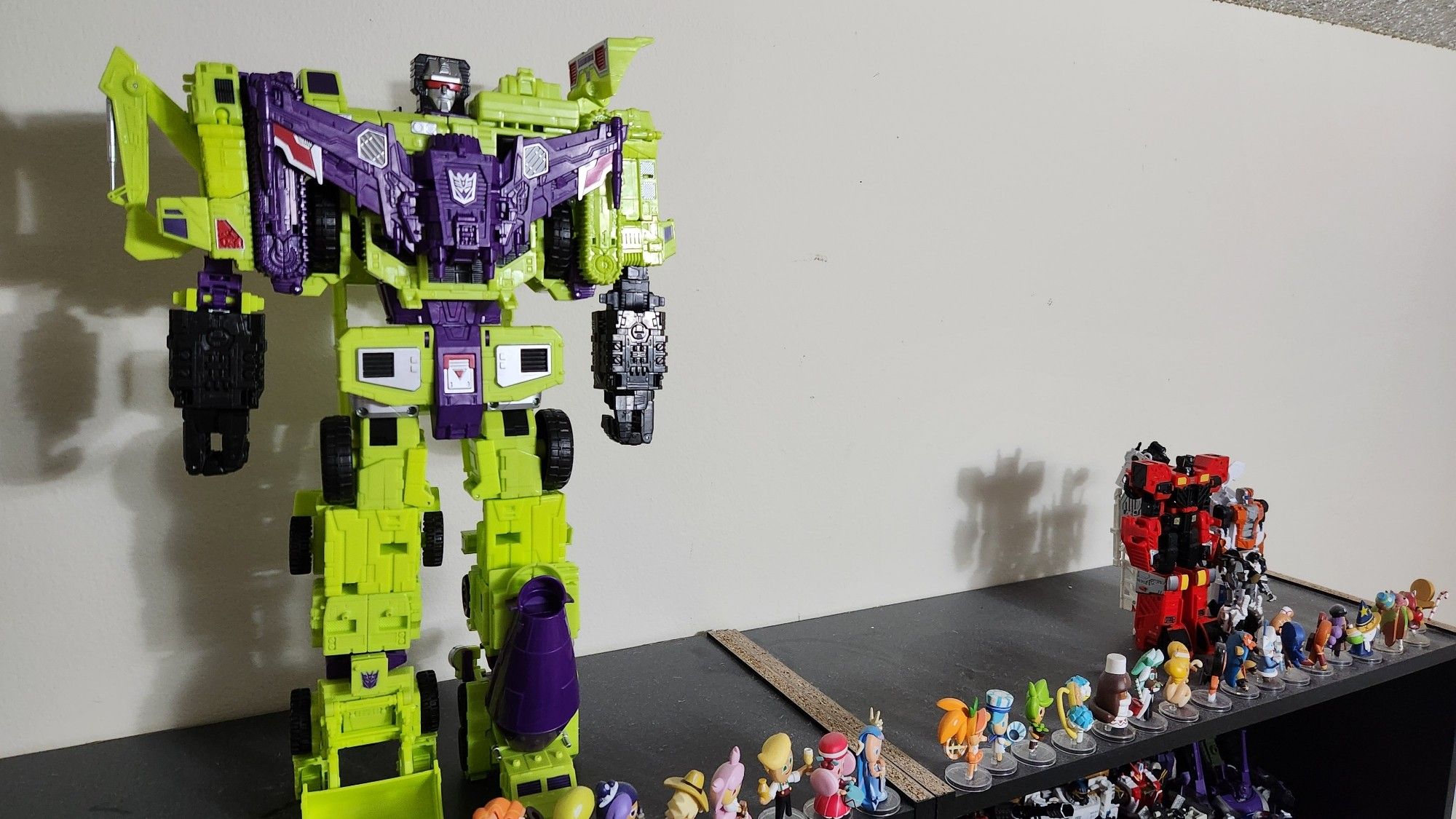 A shelf with two Combiners on it, one complete and one incomplete