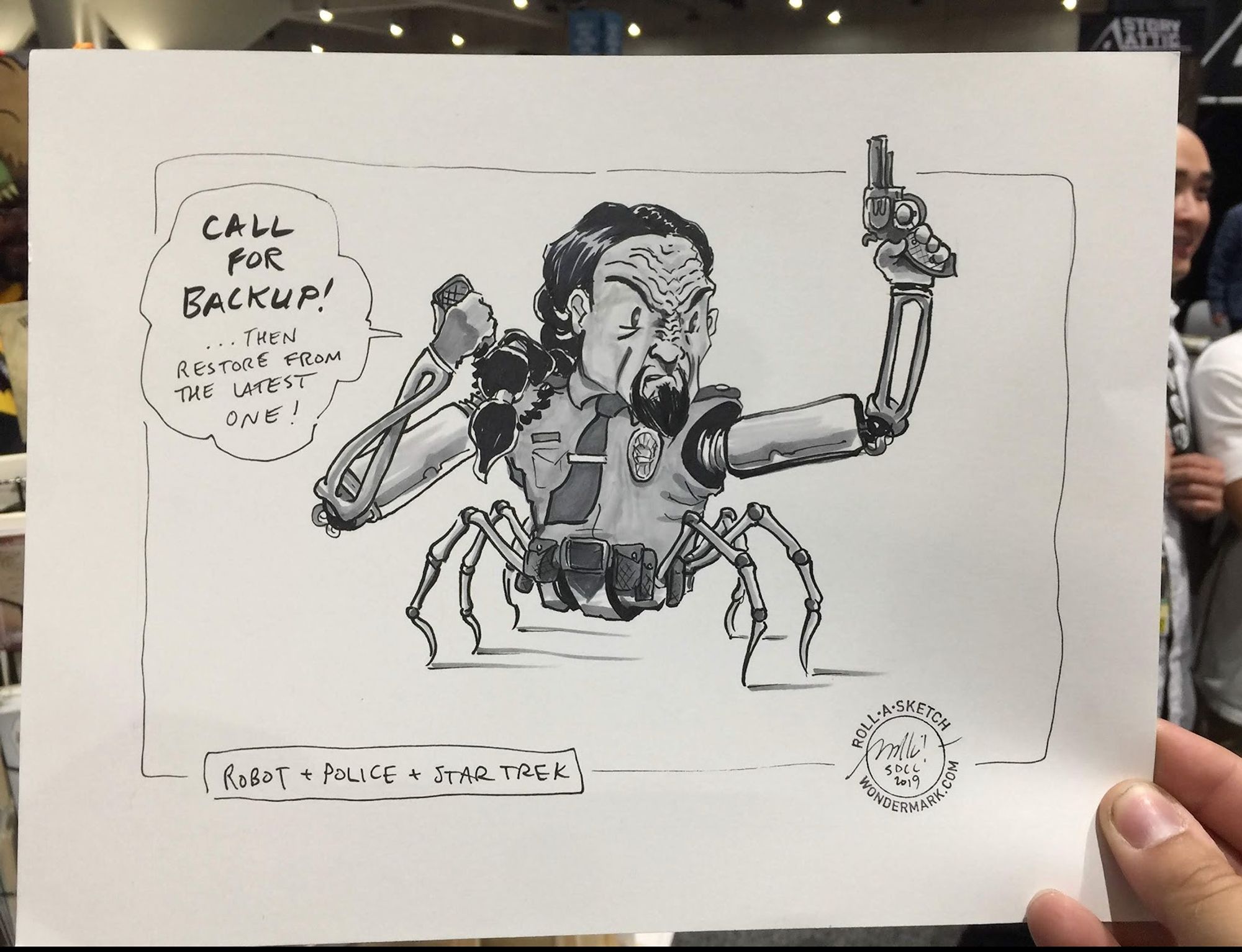 a Klingon in a police uniform with a robot spider body. into a walkie, he says "CALL FOR BACKUP! ...Then restore from the latest one!"