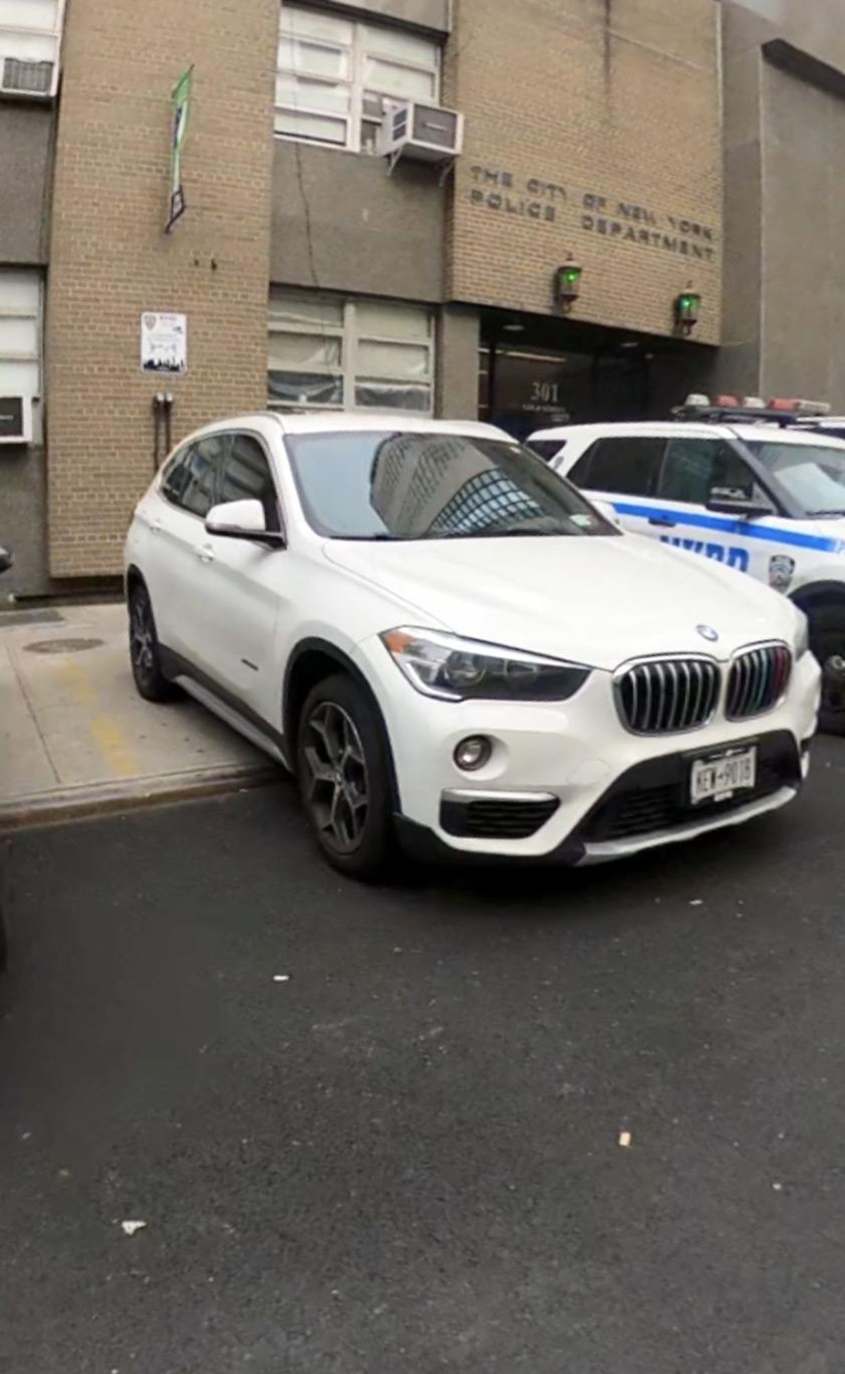 A non-emergency vehicle illegally parked on the sidewalk