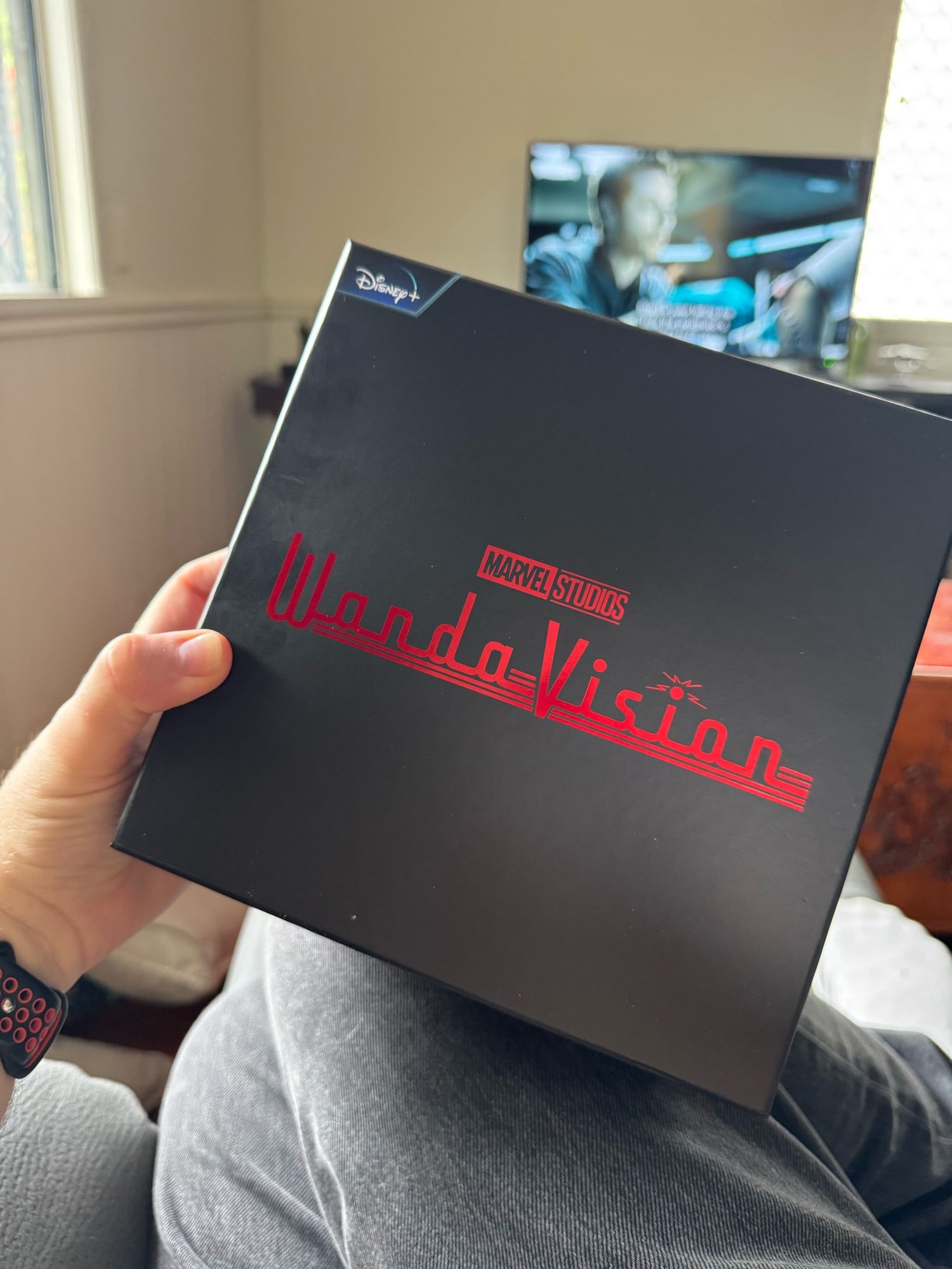 A black box with foiled red writing saying WandaVision