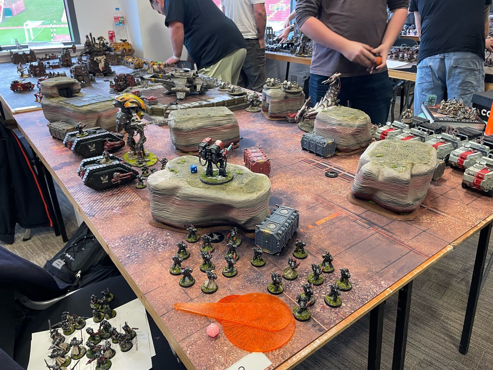 Militia and Dark angels face off over a rocky landscape